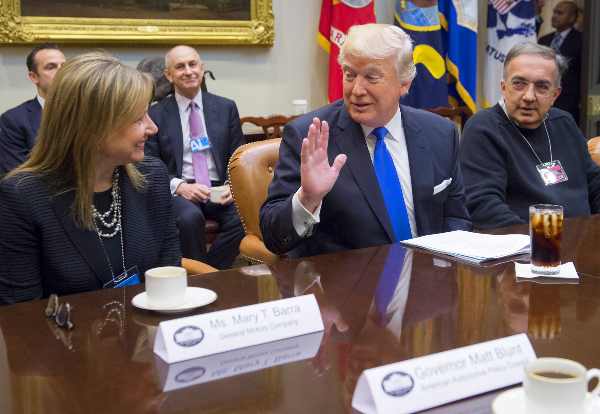 US President Donald Trump speaks alongside General Motors CEO Mary Barra (L) and Fiat Chrysler CEO Sergio Marchionne (R) during a meeting with automobile industry leaders in the Roosevelt Room of the White House in Washington, DC, January 24, 2017.