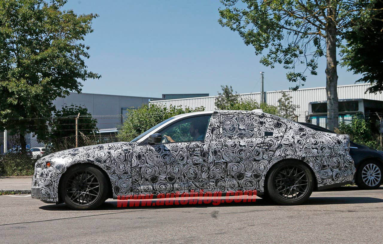 camouflaged bmw m5 spy shots hood