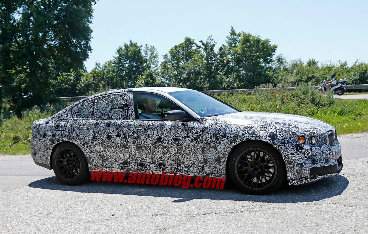 camouflaged bmw m5 spy shots roofline