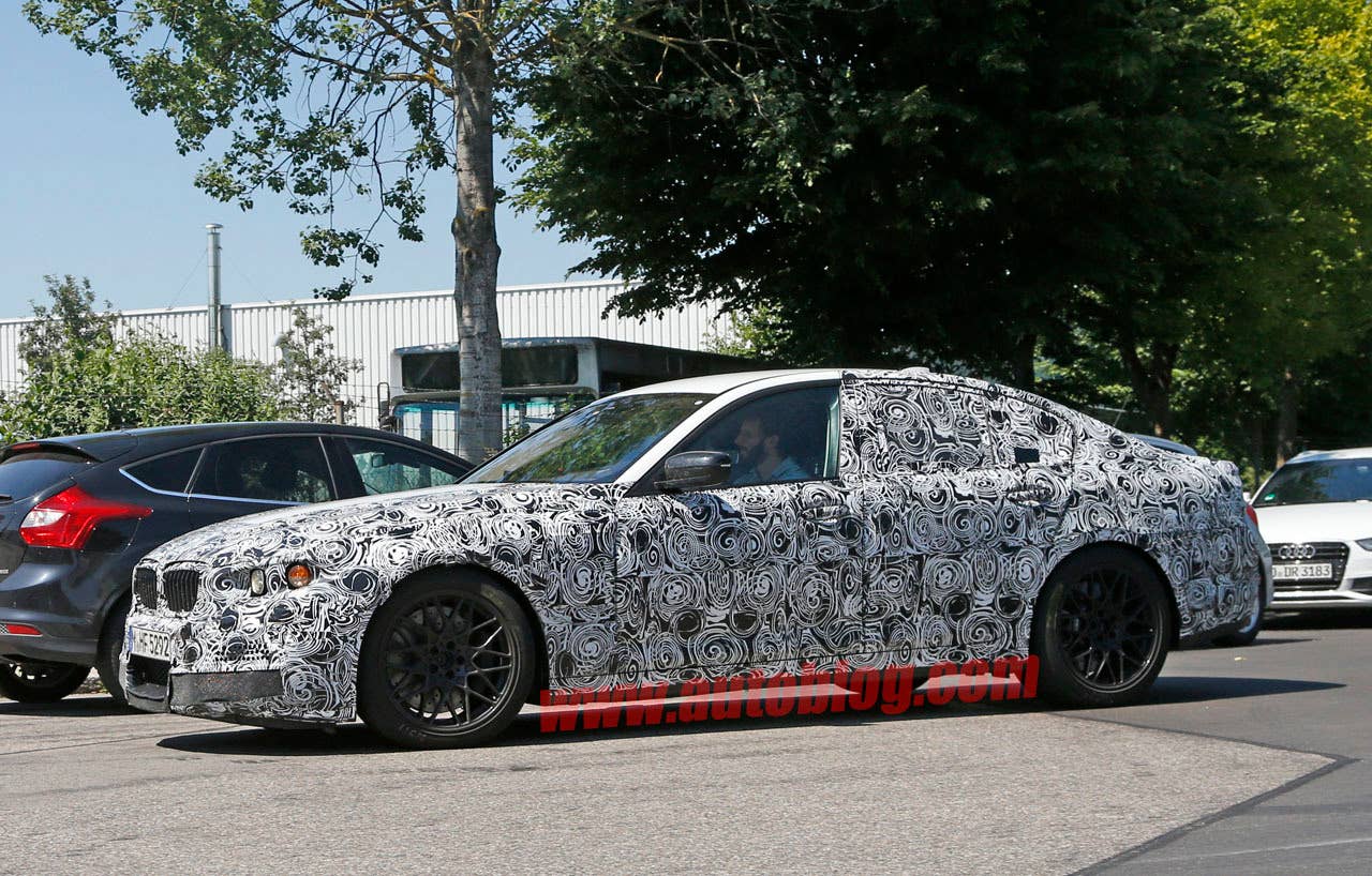 camouflaged bmw m5 spy shots wheels and brakes