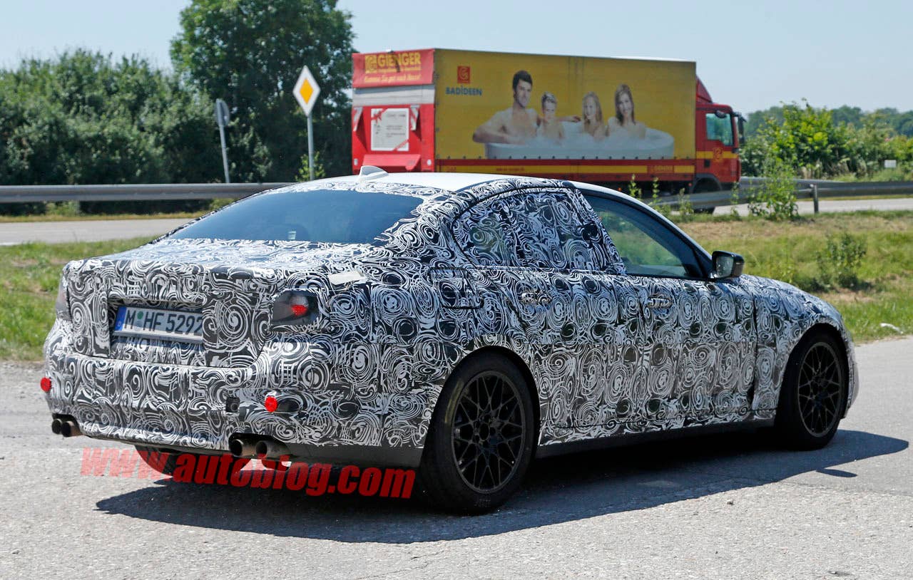 camouflaged bmw m5 spy shots wheel design