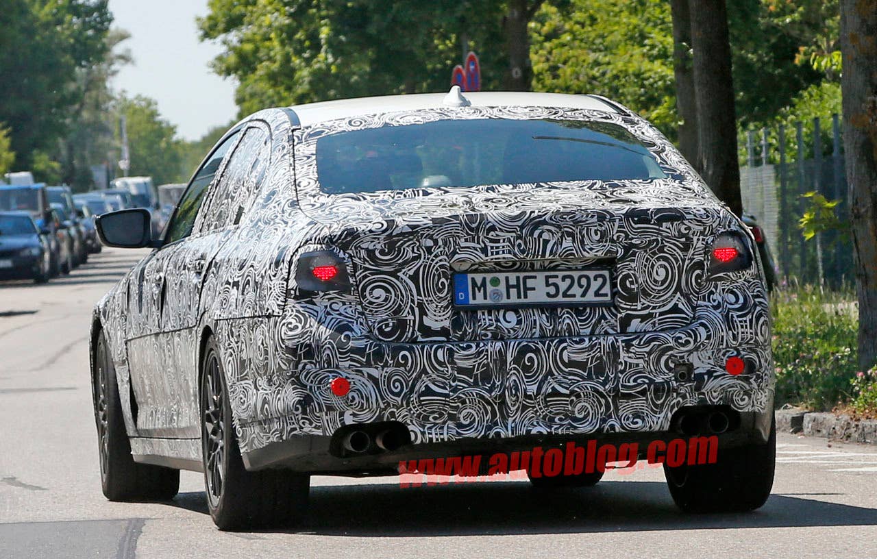 camouflaged bmw m5 spy shots rear end