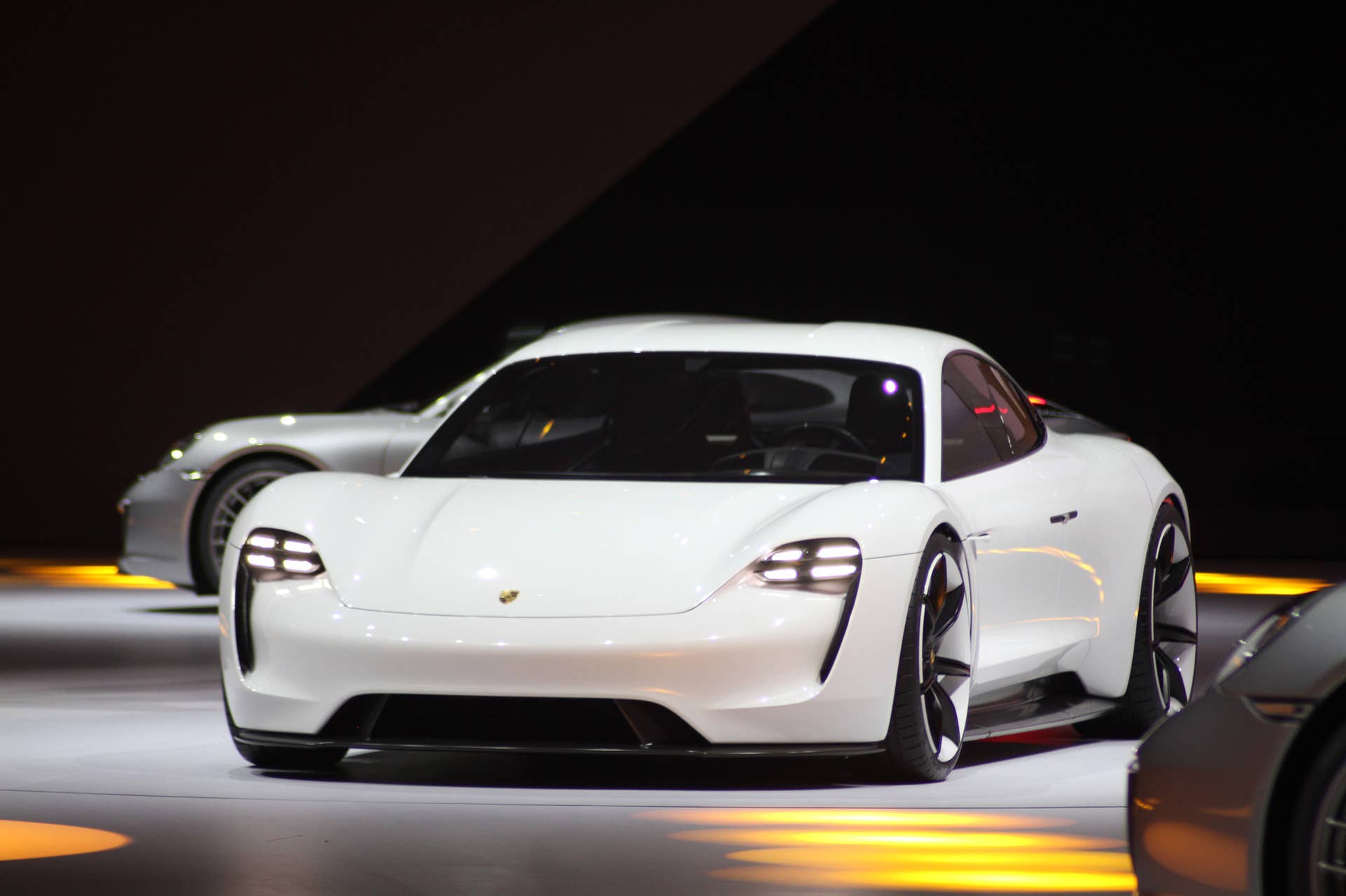 The electric Porsche Mission E concept, showed off at the Volkswagen Group Night ahead of the 2015 Frankfurt Motor Show, near front three-quarter view.