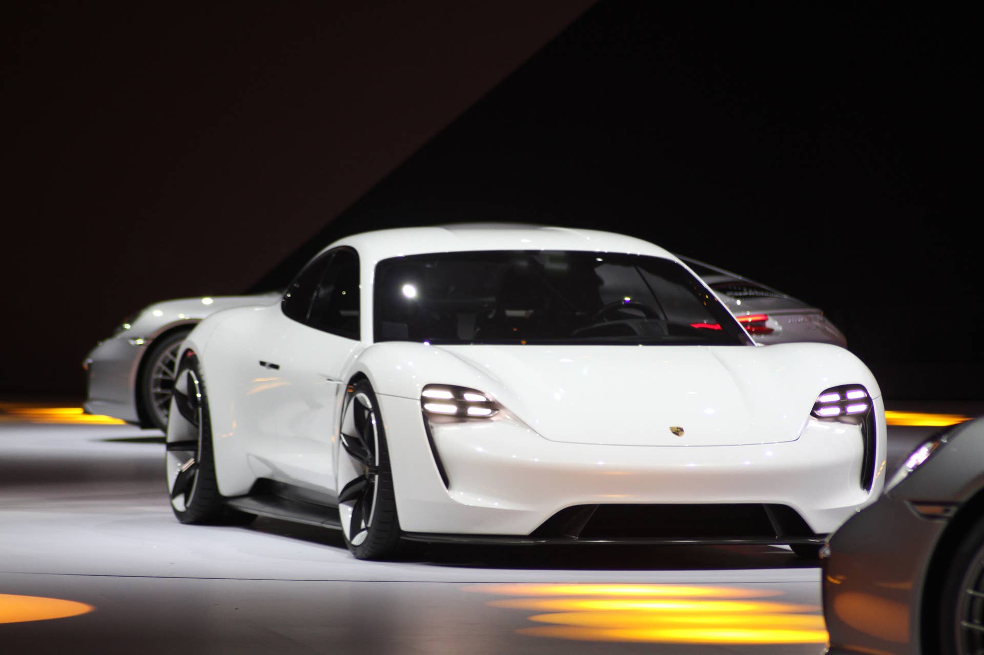 The electric Porsche Mission E concept, showed off at the Volkswagen Group Night ahead of the 2015 Frankfurt Motor Show, front three-quarter view.