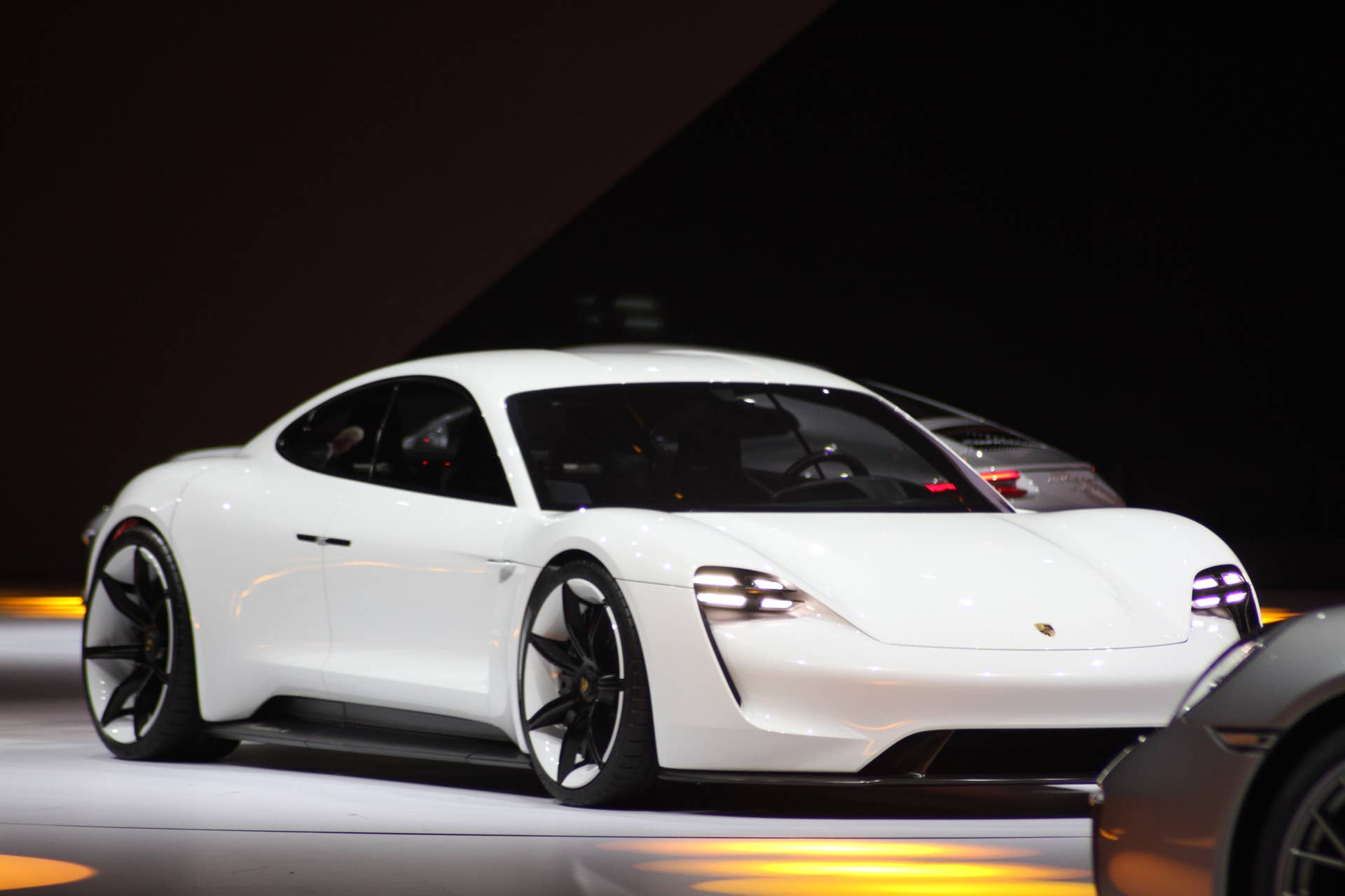 The electric Porsche Mission E concept, showed off at the Volkswagen Group Night ahead of the 2015 Frankfurt Motor Show, front three-quarter view.