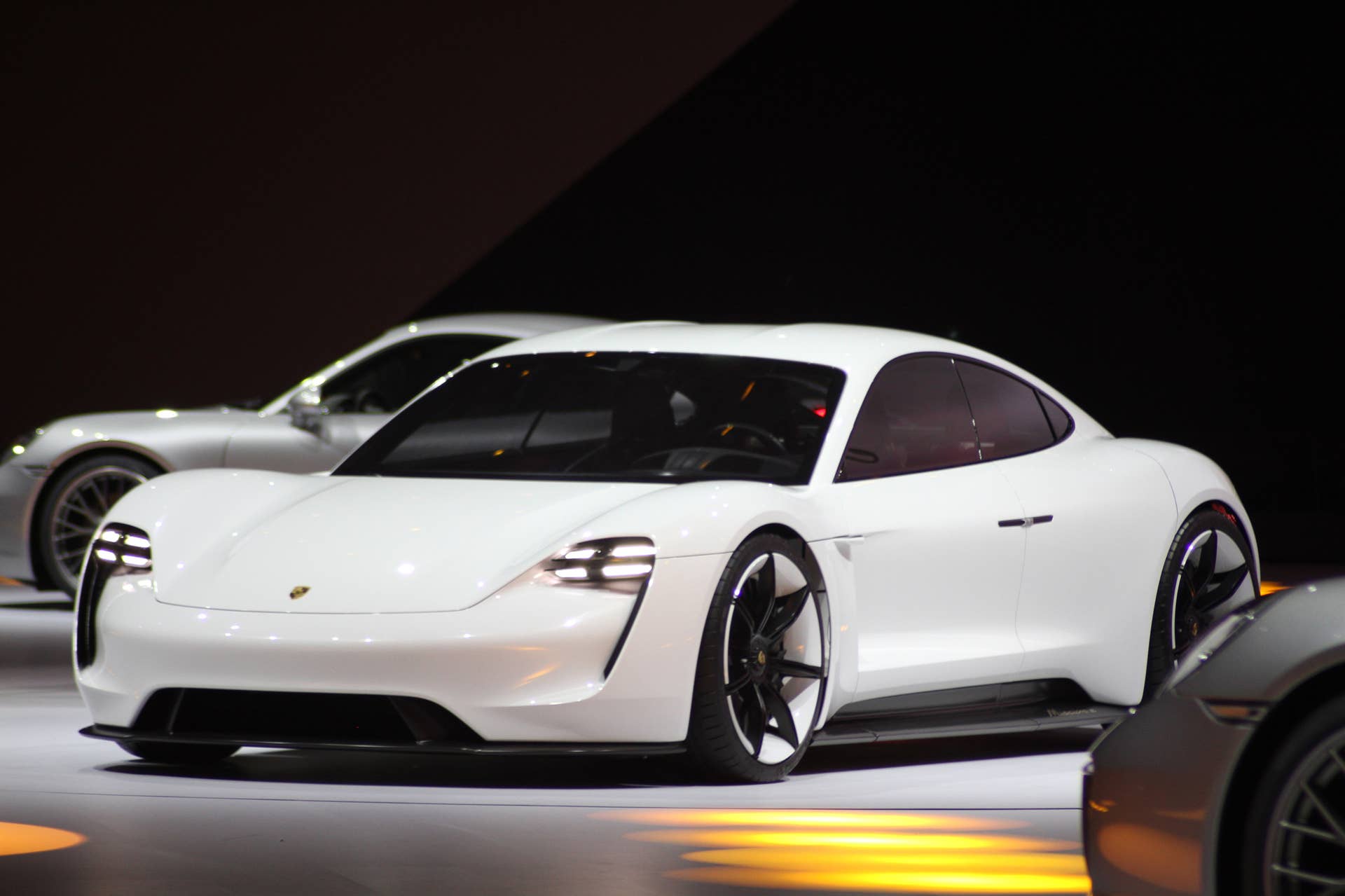 The electric Porsche Mission E concept, showed off at the Volkswagen Group Night ahead of the 2015 Frankfurt Motor Show, front three-quarter view.