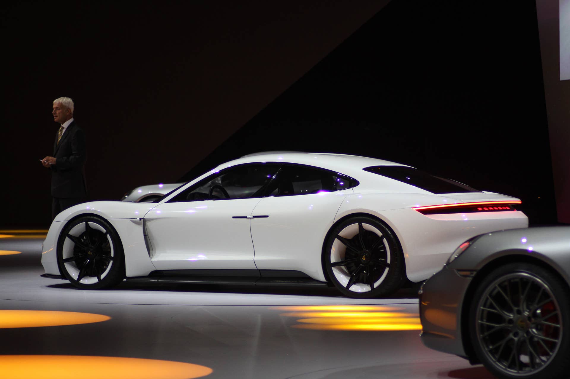 The electric Porsche Mission E concept, showed off at the Volkswagen Group Night ahead of the 2015 Frankfurt Motor Show, rear three-quarter.