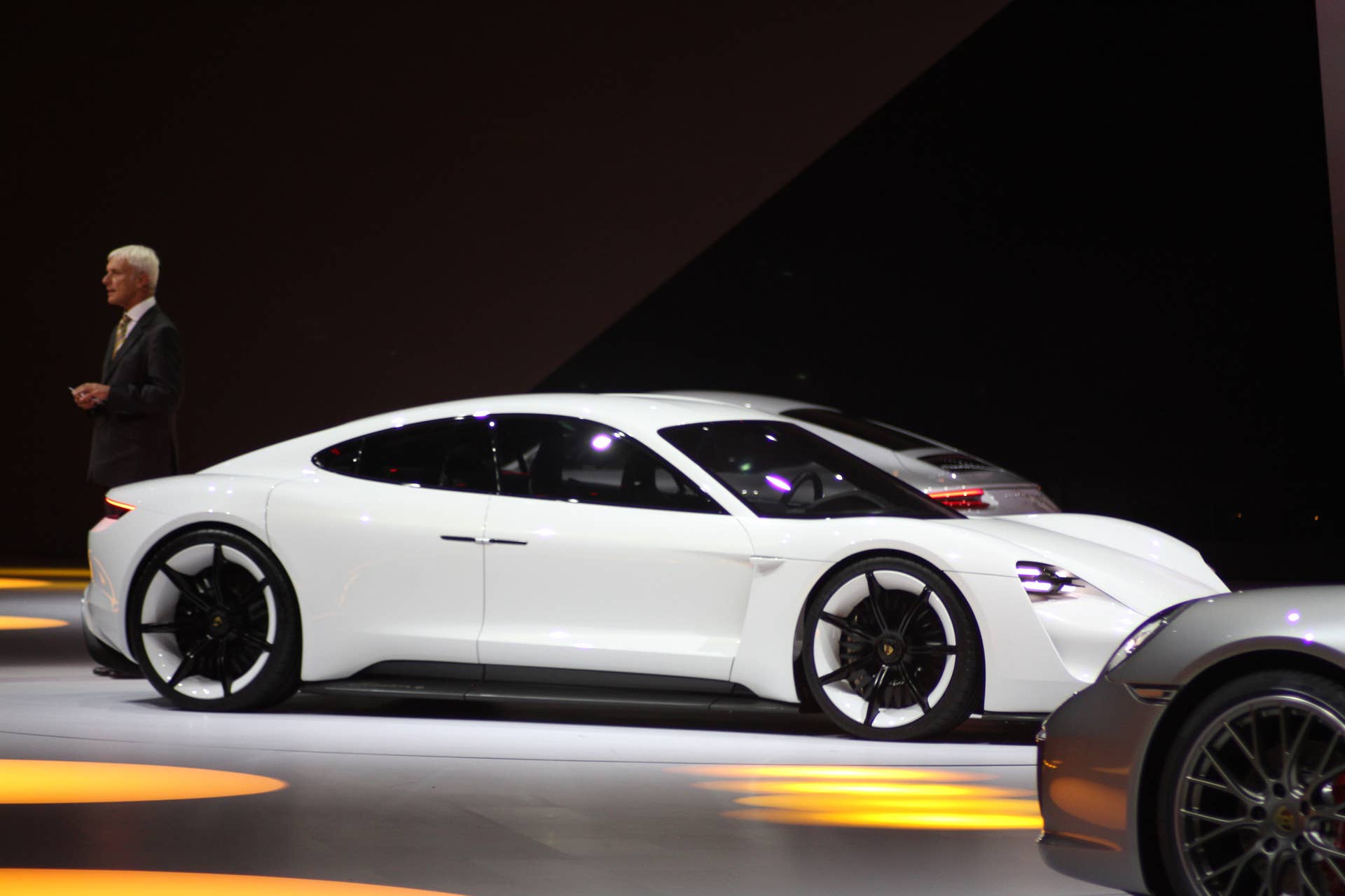 The electric Porsche Mission E concept, showed off at the Volkswagen Group Night ahead of the 2015 Frankfurt Motor Show, front three quarter.