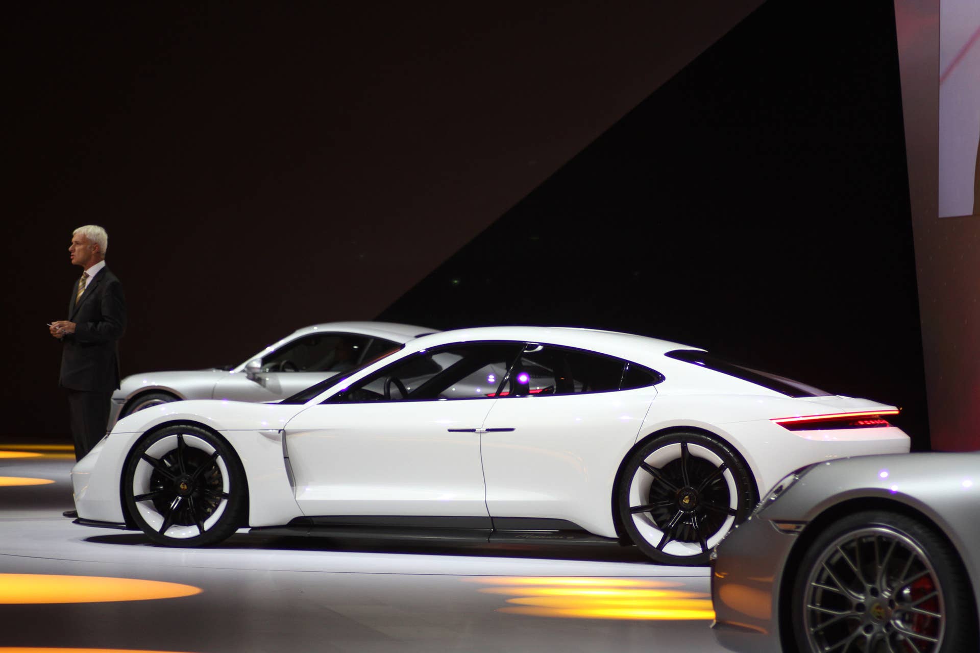 The electric Porsche Mission E concept, showed off at the Volkswagen Group Night ahead of the 2015 Frankfurt Motor Show, long view of the driver's side.