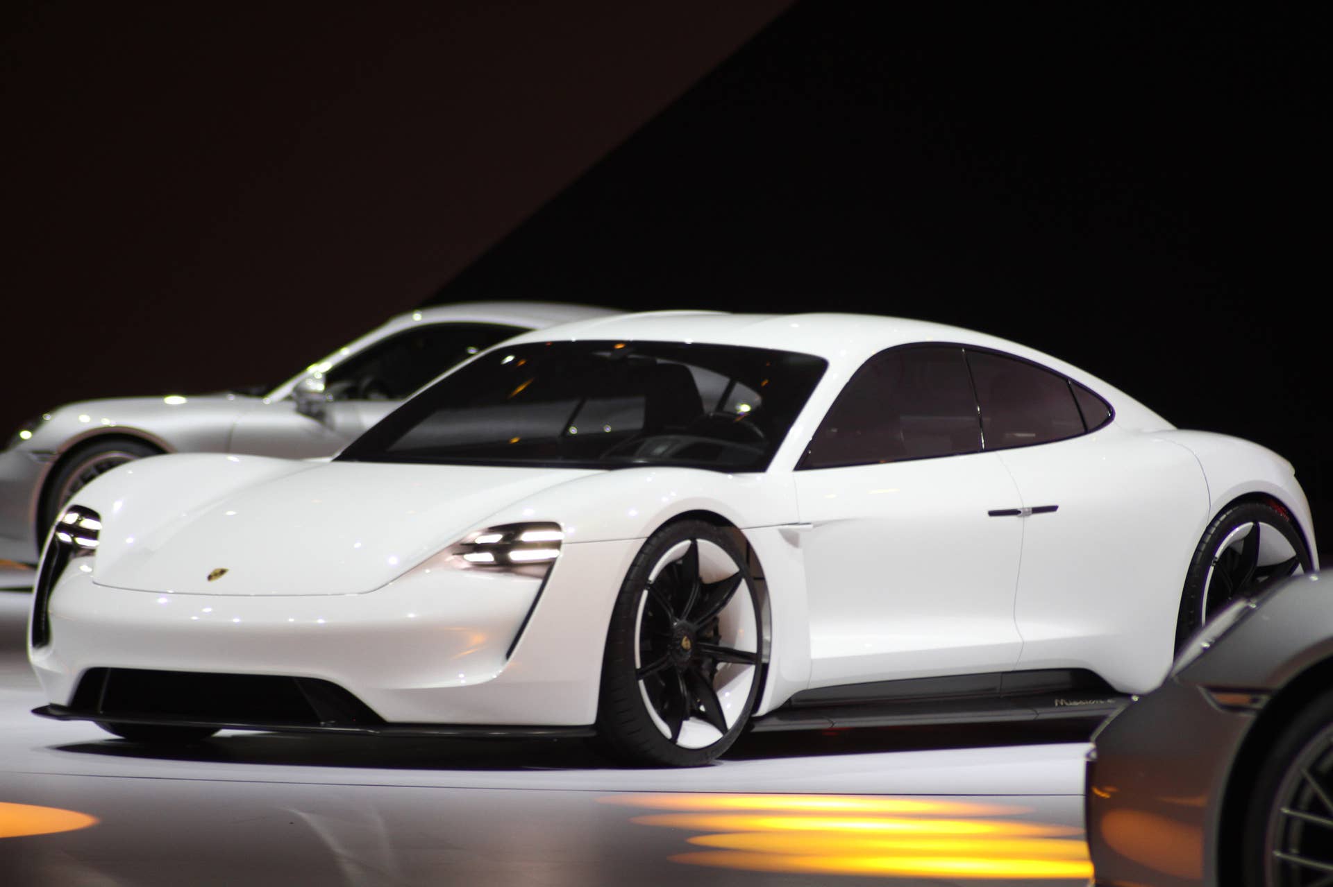 The electric Porsche Mission E concept, showed off at the Volkswagen Group Night ahead of the 2015 Frankfurt Motor Show, front three-quarter view.