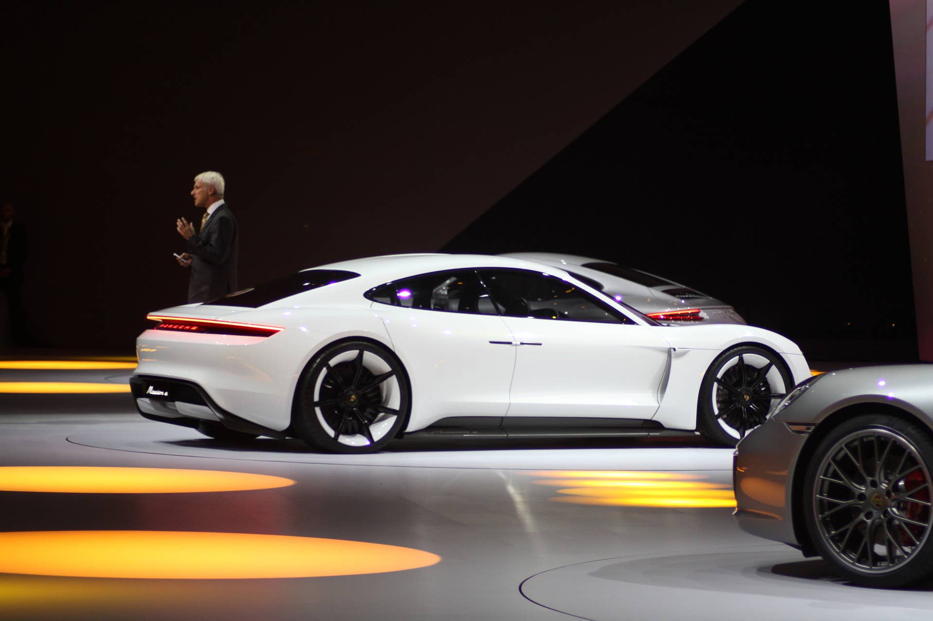 The electric Porsche Mission E concept, showed off at the Volkswagen Group Night ahead of the 2015 Frankfurt Motor Show, rear three-quarter view, passenger's side.