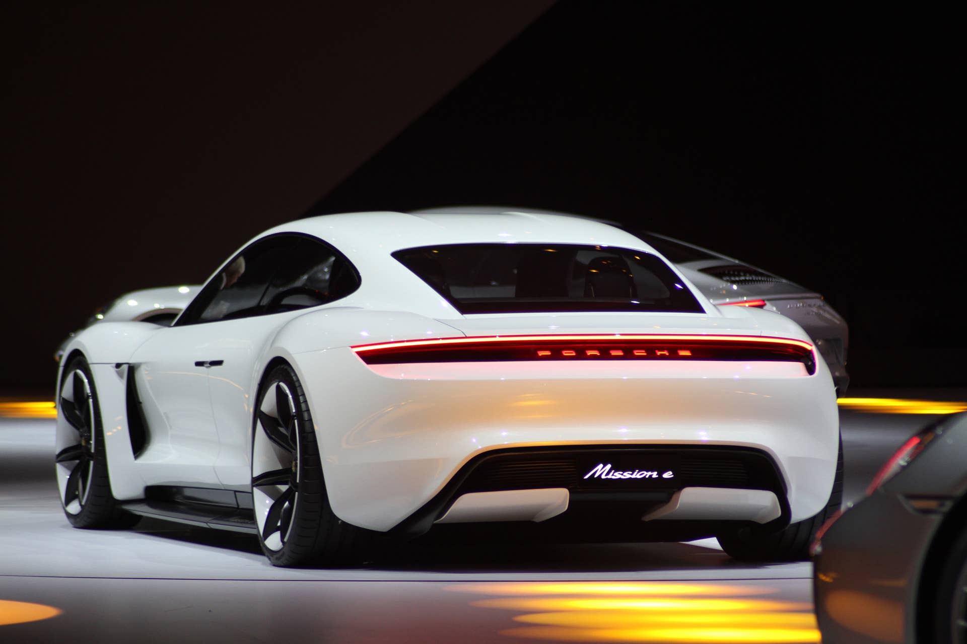 The electric Porsche Mission E concept, showed off at the Volkswagen Group Night ahead of the 2015 Frankfurt Motor Show, rear three-quarter view.
