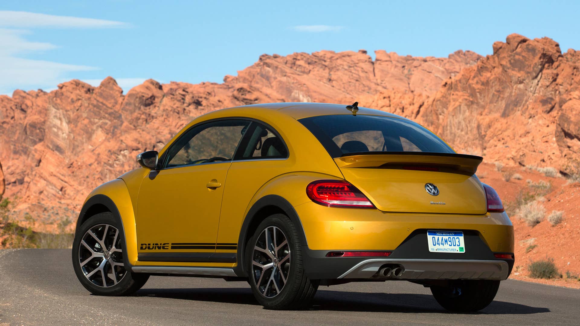 vw beetle dune coupe rear three quarters in desert