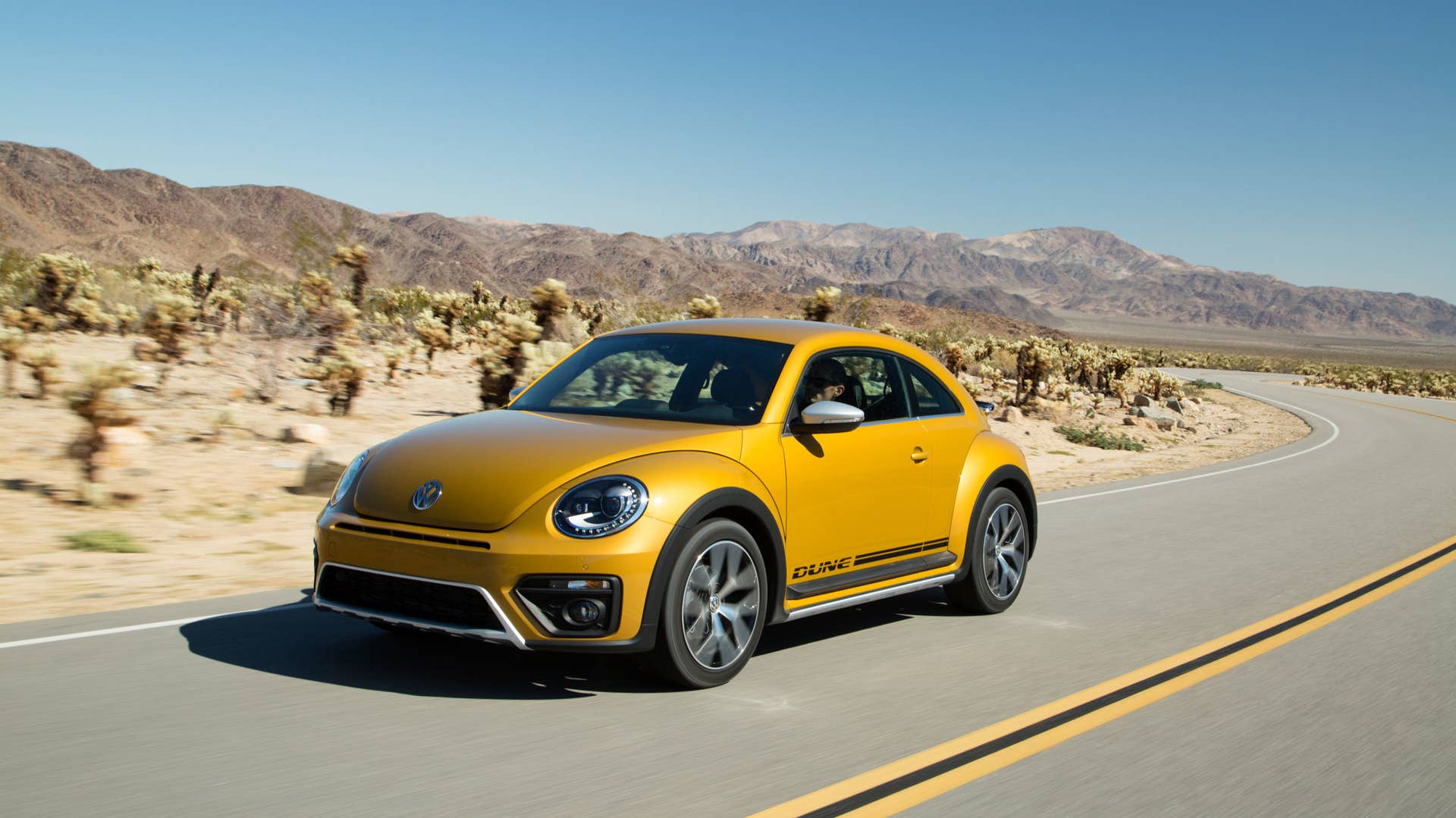 vw beetle dune coupe on the road