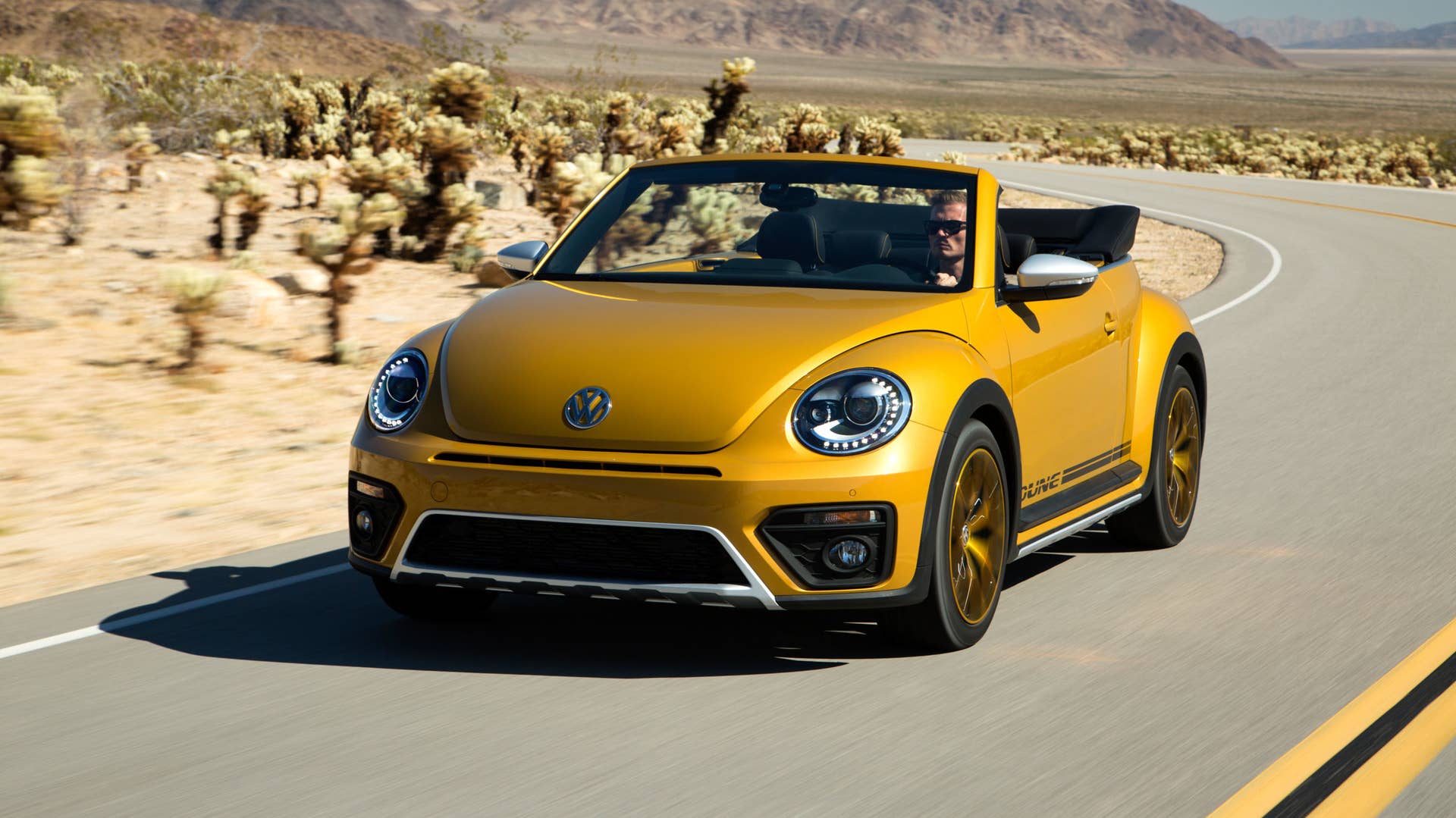 vw beetle dune convertible on the road