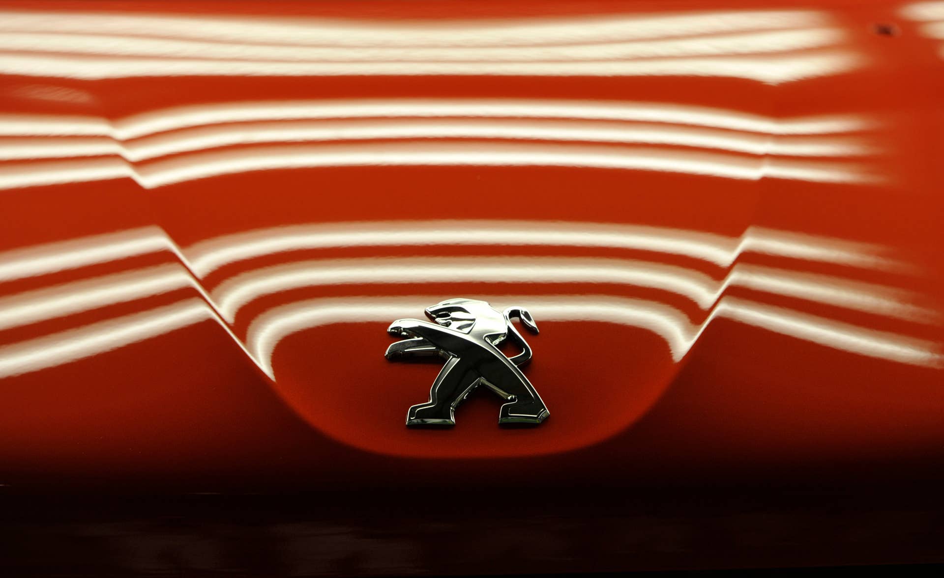 The Peugeot logo is pictured on the front lid of a Peugeot 208 car by French car maker PSA Peugeot Citroen on the assembly line at the company's automobile factory in Trnava, western Slovakia, on December 3, 2015. AFP PHOTO / SAMUEL KUBANI / AFP / SAMUEL KUBANI (Photo credit should read SAMUEL KUBANI/AFP/Getty Images)