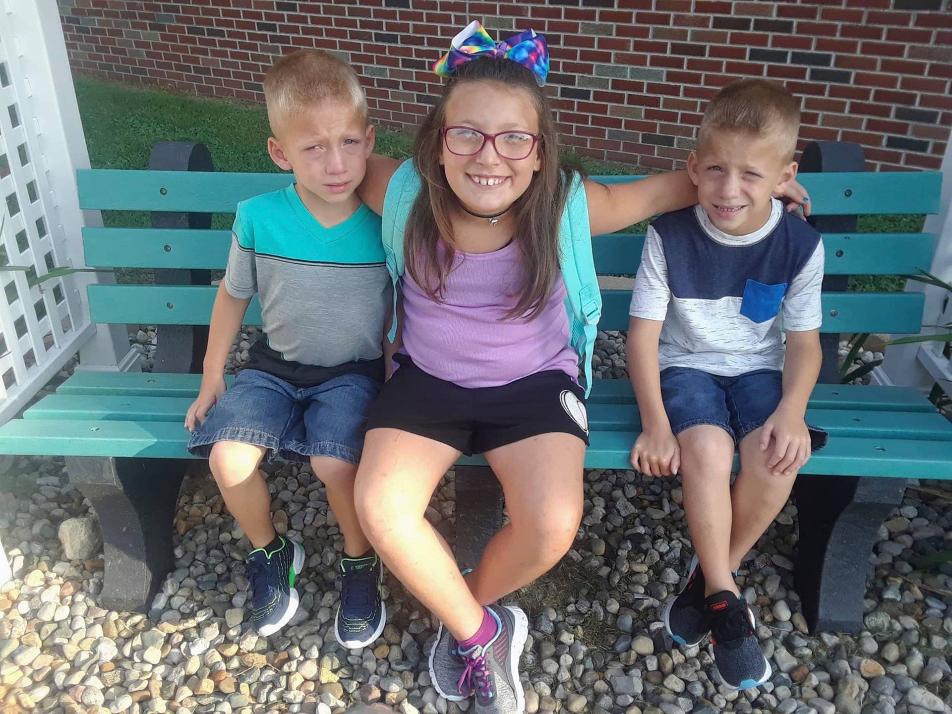 This undated family photo provided by Elgin Ingle shows Alivia Stahl, center, and her twin brothers, Xzavier and Mason Ingle. The three children were struck and killed Tuesday, Oct. 30, 2018, by a pickup truck as they crossed a road in rural Rochester, Ind., to board a school bus before sunrise. The driver of the pickup Alyssa Shepherd, of Rochester, was arrested and charged with three counts of reckless homicide and one misdemeanor count of passing a school bus when arm signal device is extended, causing bodily injury. (Elgin Ingle via AP)