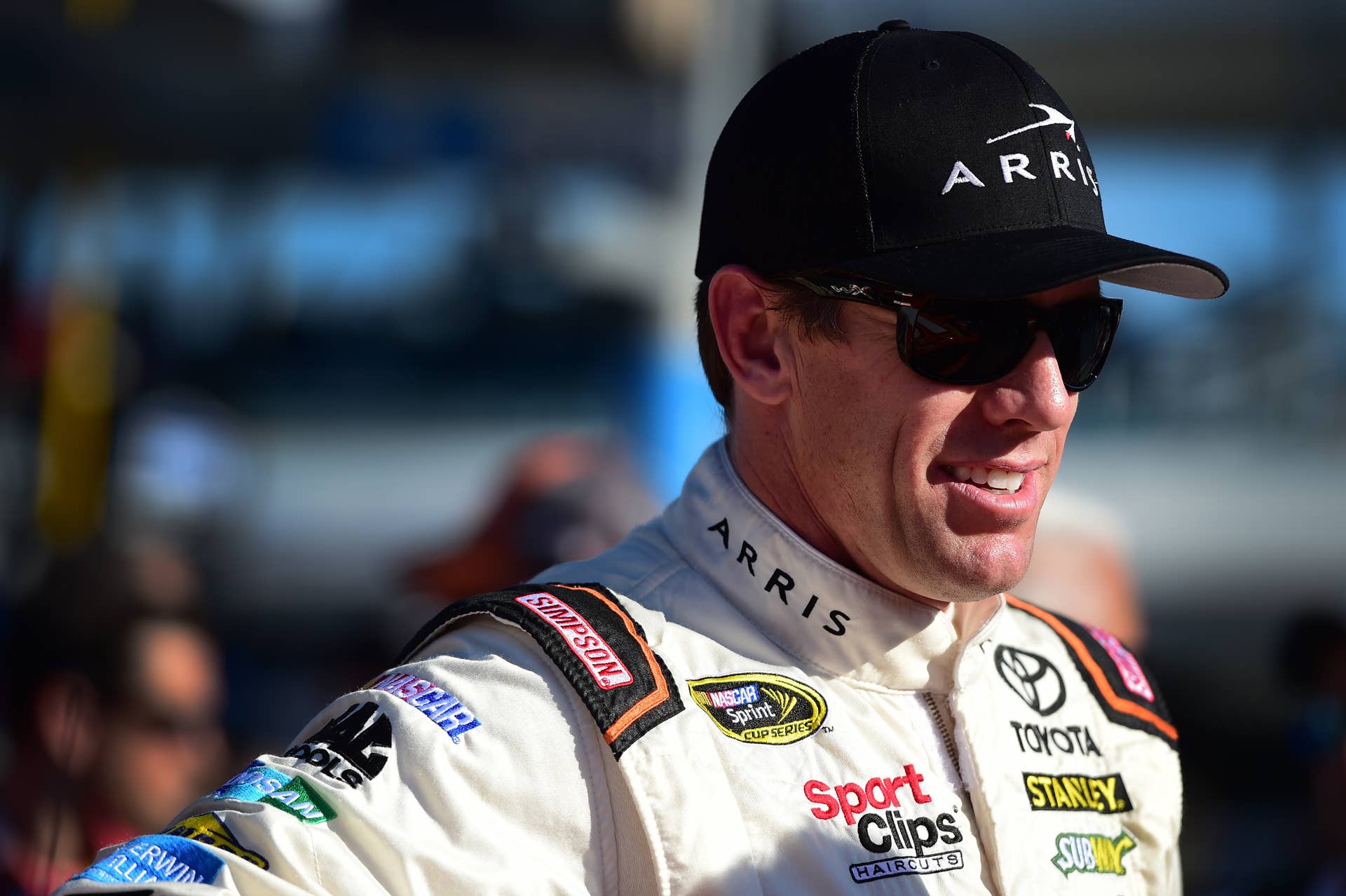 HOMESTEAD, FL - NOVEMBER 20: Carl Edwards, driver of the #19 ARRIS Toyota, stands on the grid prior to the NASCAR Sprint Cup Series Ford EcoBoost 400 at Homestead-Miami Speedway on November 20, 2016 in Homestead, Florida. (Photo by Jared C. Tilton/Getty Images)