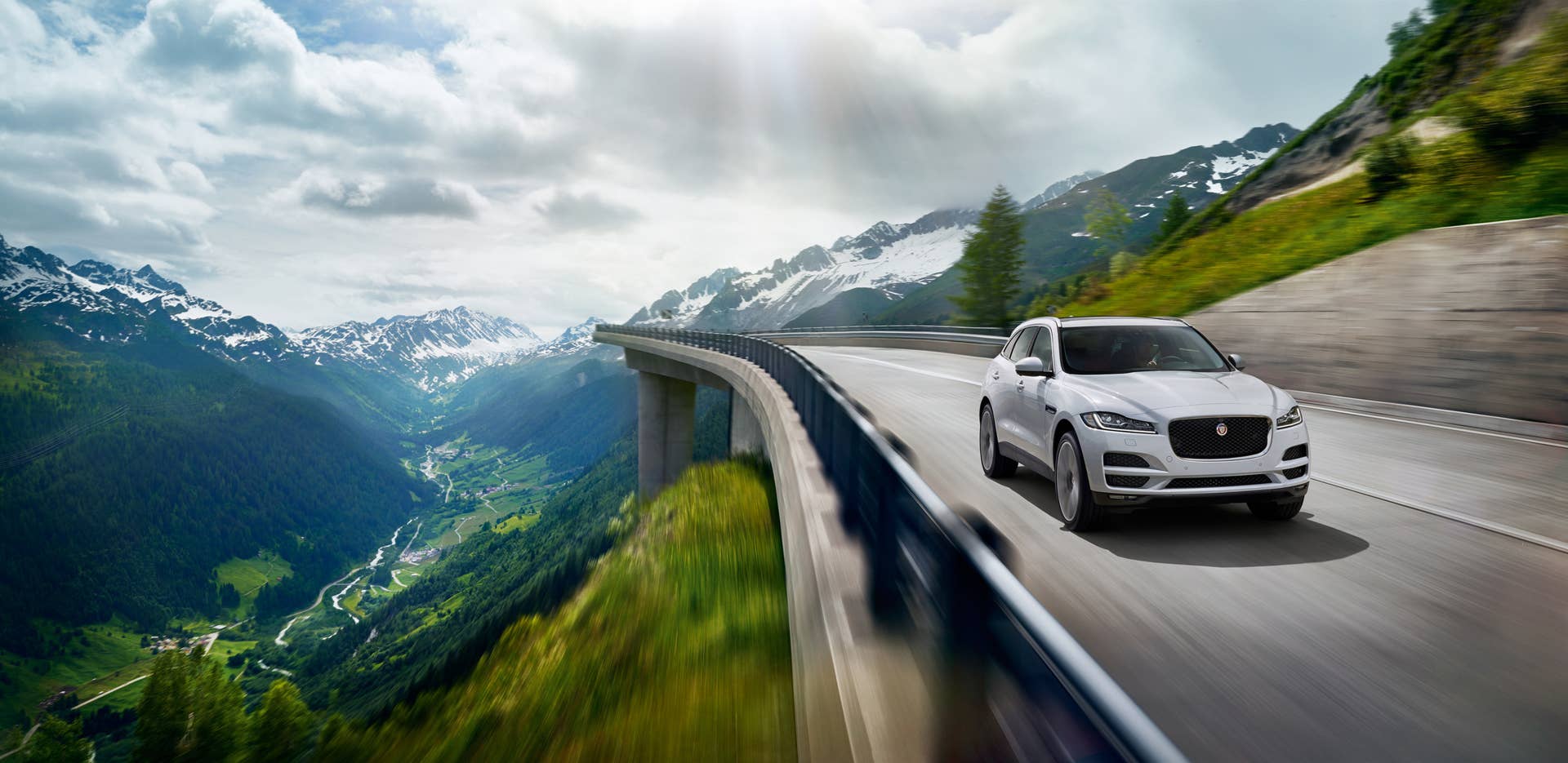 jaguar f-pace mountain bridge white action speed