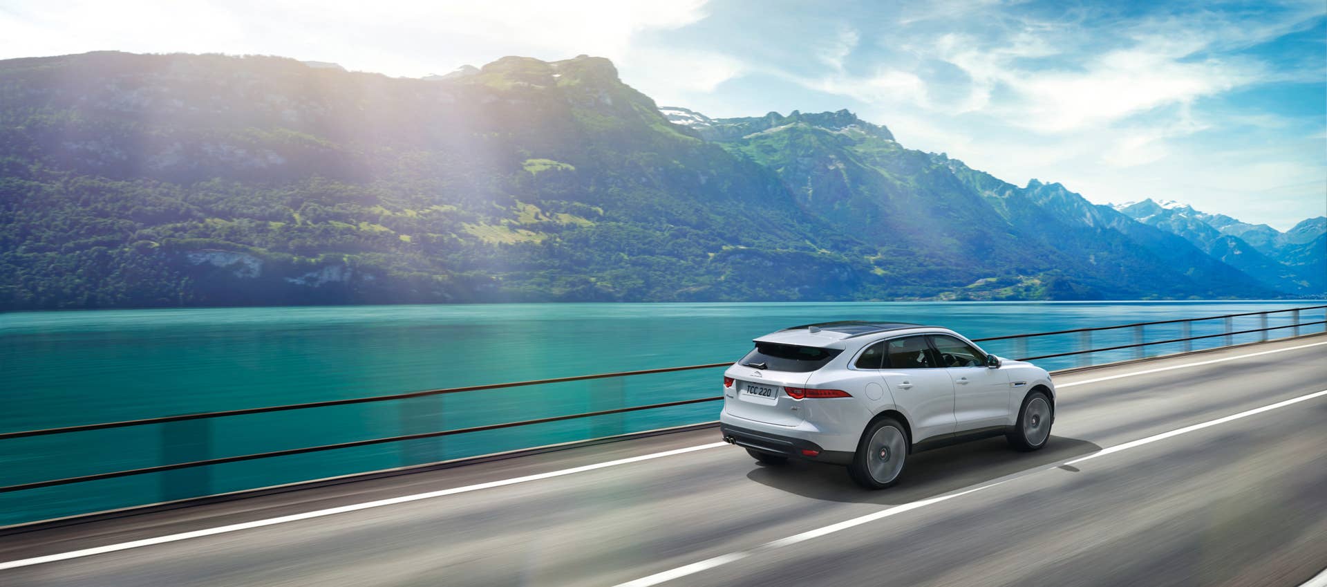 cuv rear action jaguar f-pace lake mountain