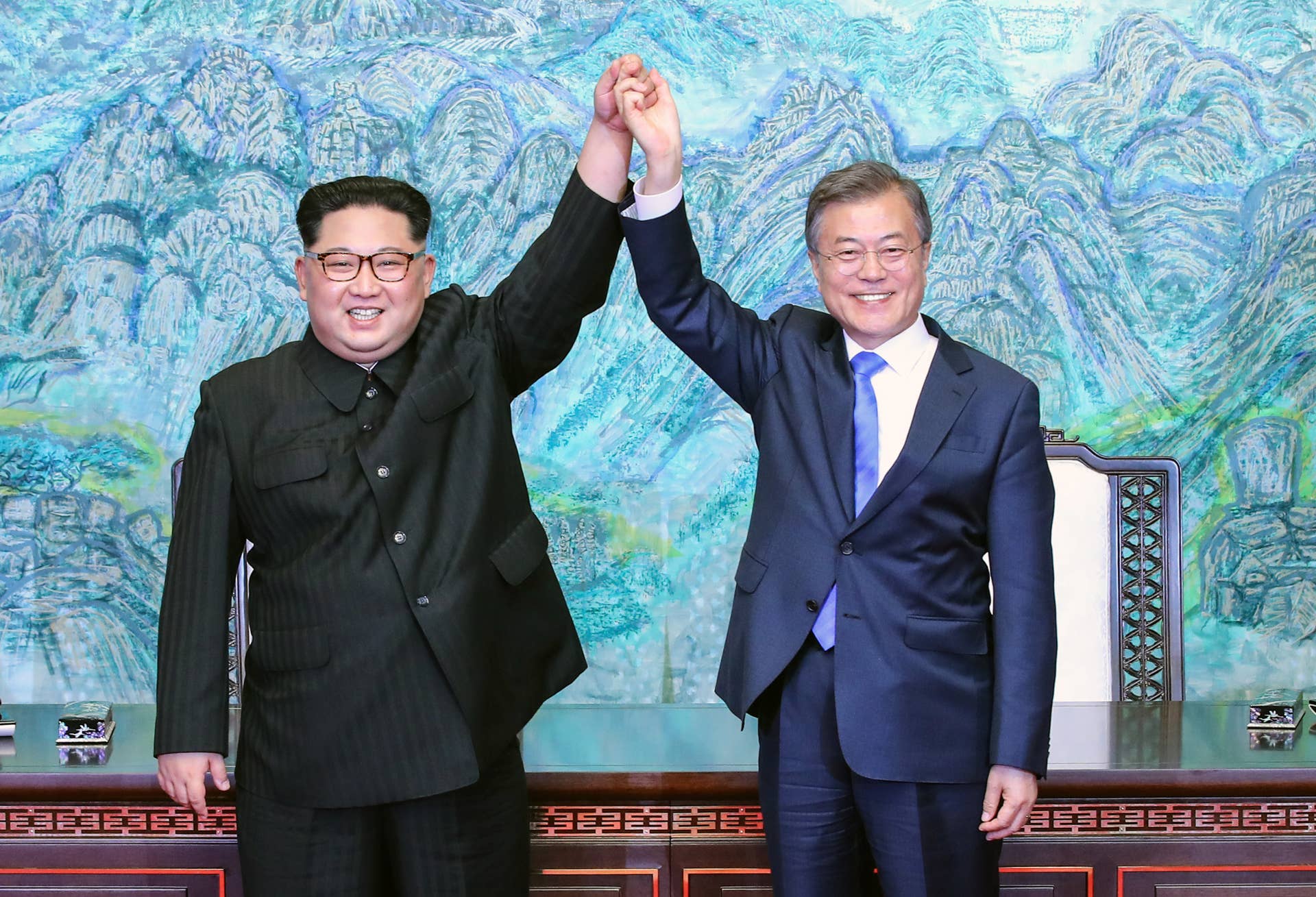 PANMUNJOM, SOUTH KOREA - APRIL 27: North Korean leader Kim Jong Un (L) and South Korean President Moon Jae-in (R) pose for photographs after signing the Panmunjom Declaration for Peace, Prosperity and Unification of the Korean Peninsula during the Inter-Korean Summit at the Peace House on April 27, 2018 in Panmunjom, South Korea. Kim and Moon meet at the border today for the third-ever Inter-Korean summit talks after the 1945 division of the peninsula, and first since 2007 between then President Roh Moo-hyun of South Korea and Leader Kim Jong-il of North Korea. (Photo by Korea Summit Press Pool/Getty Images)