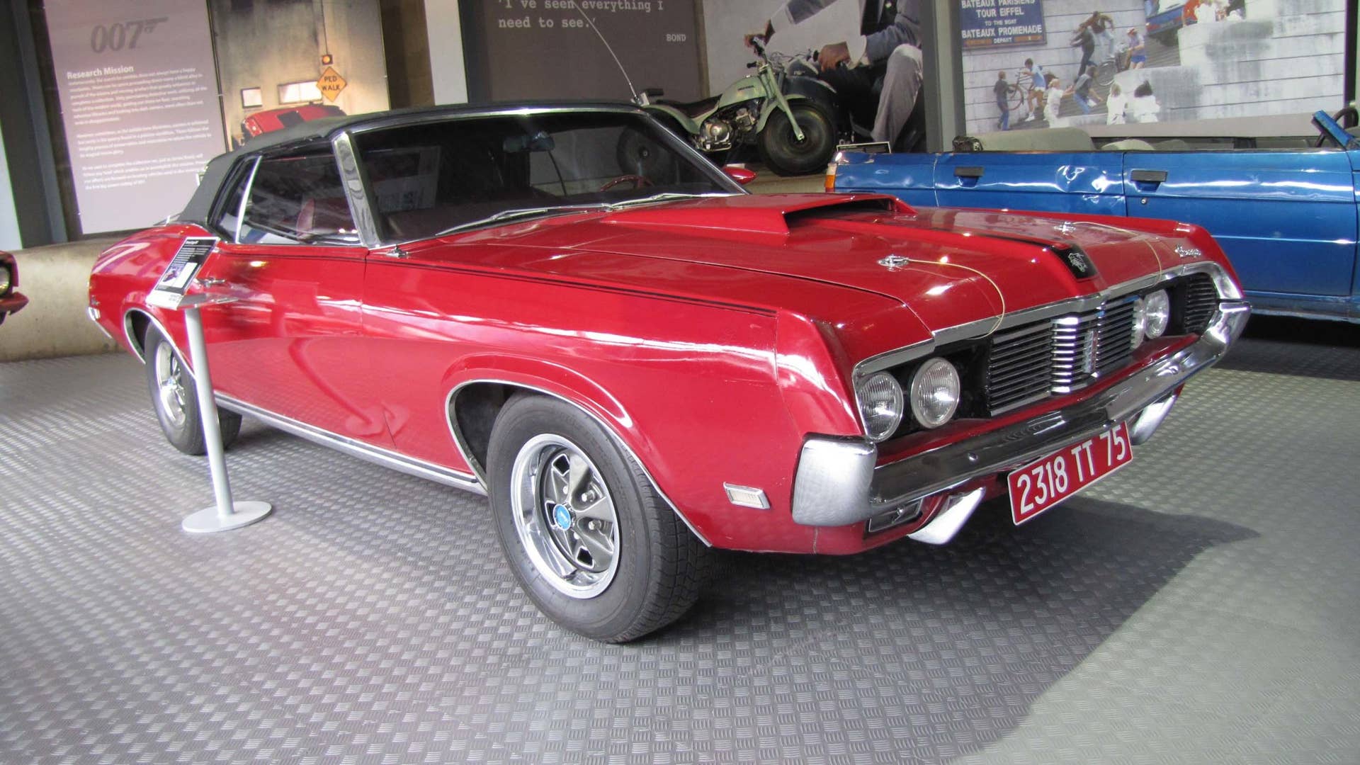 Tracy's Cougar looks just as good today as it did in 1969. Those hood latch cables signify the Cobra Jet engine (and Ram Air scoop), a 428 V8 good for 335 horsepower. A rare option and the best you could get in 1969 -- perfect for Mrs. Bond.