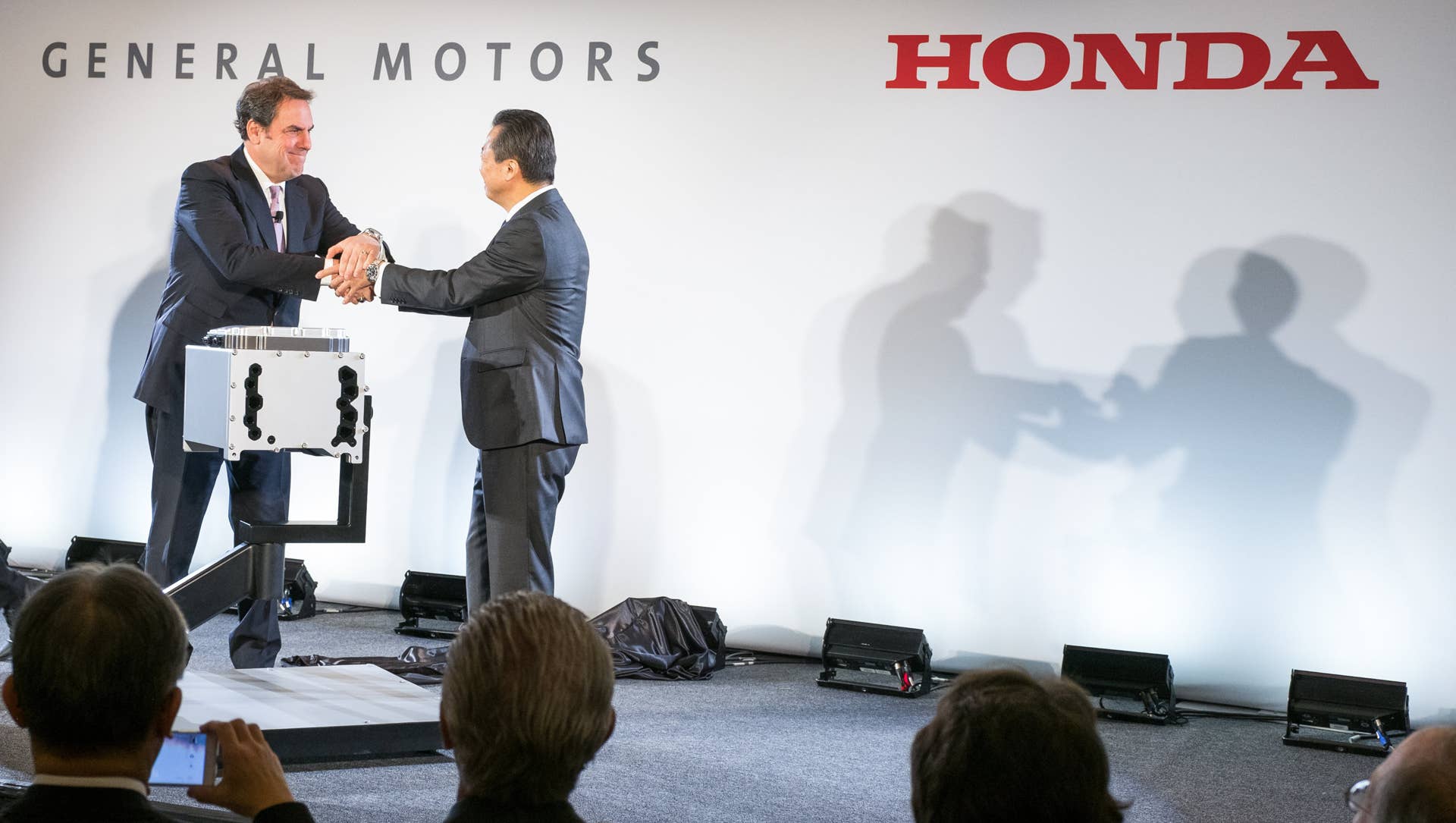 General Motors Executive Vice President Global Product Development Mark Reuss (left) and Honda CEO North American Region and President Honda North America Toshiaki Mikoshiba announce a manufacturing joint venture to mass produce an advanced hydrogen fuel cell system that will be used in future products from each company, Monday, January 30, 2017 in Detroit, Michigan. Fuel Cell System Manufacturing, LLC will operate within GMâs existing battery pack manufacturing facility site in Brownstown, Michigan. Mass production of fuel cell systems is expected to begin around 2020 and create nearly 100 new jobs. (Photo by Steve Fecht for General Motors and Honda)
