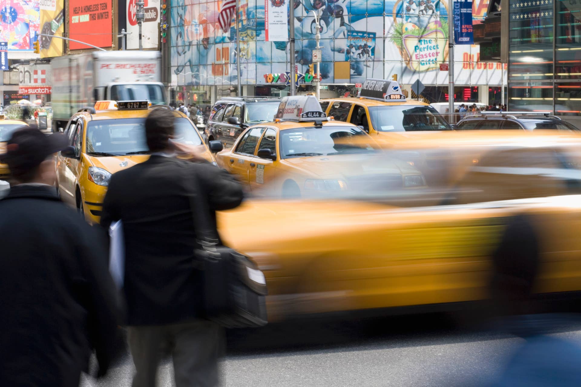 Yellow taxi's and pedestrians on a city street, Manhattan, New York City
