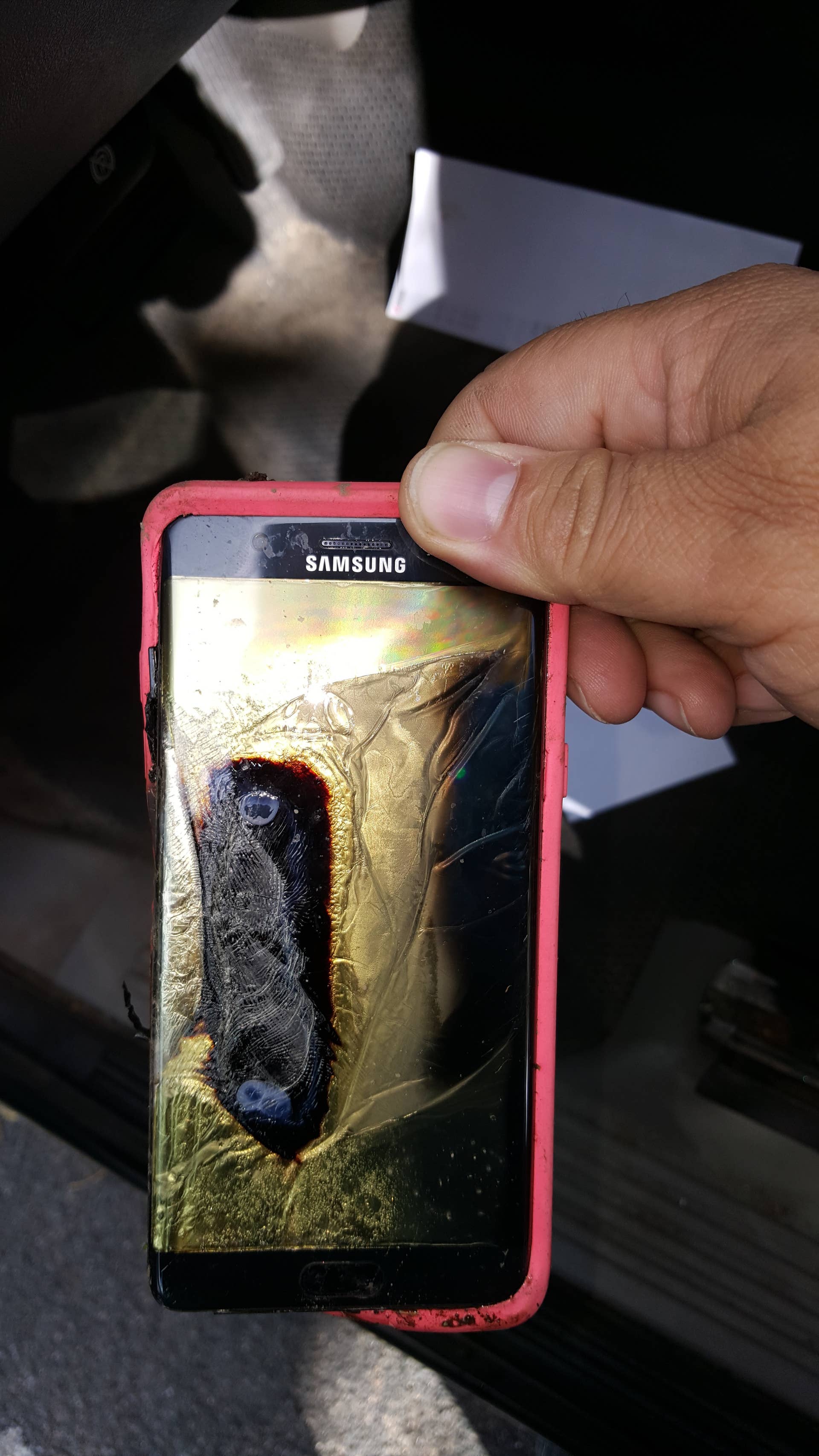 This Friday, Oct. 7, 2016, photo provided by Andrew Zuis, of Farmington, Minn., shows the replacement Samsung Galaxy Note 7 phone belonging to his 13-year-old daughter Abby, that melted in her hand earlier in the day. "She's done with Note 7s right now," Zuis said of his daughter. Reports of more replacement phones catching fire are trickling in, and the South Korean tech giant faces more scrutiny after earlier criticism for being slow to react and sending confusing signals in the first days of the recall. (Andrew Zuis via AP)