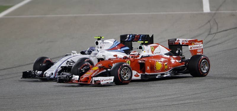 Kimi Raikkonen in the Ferrari passes a Williams at the 2016 Bahrain Grand Prix.