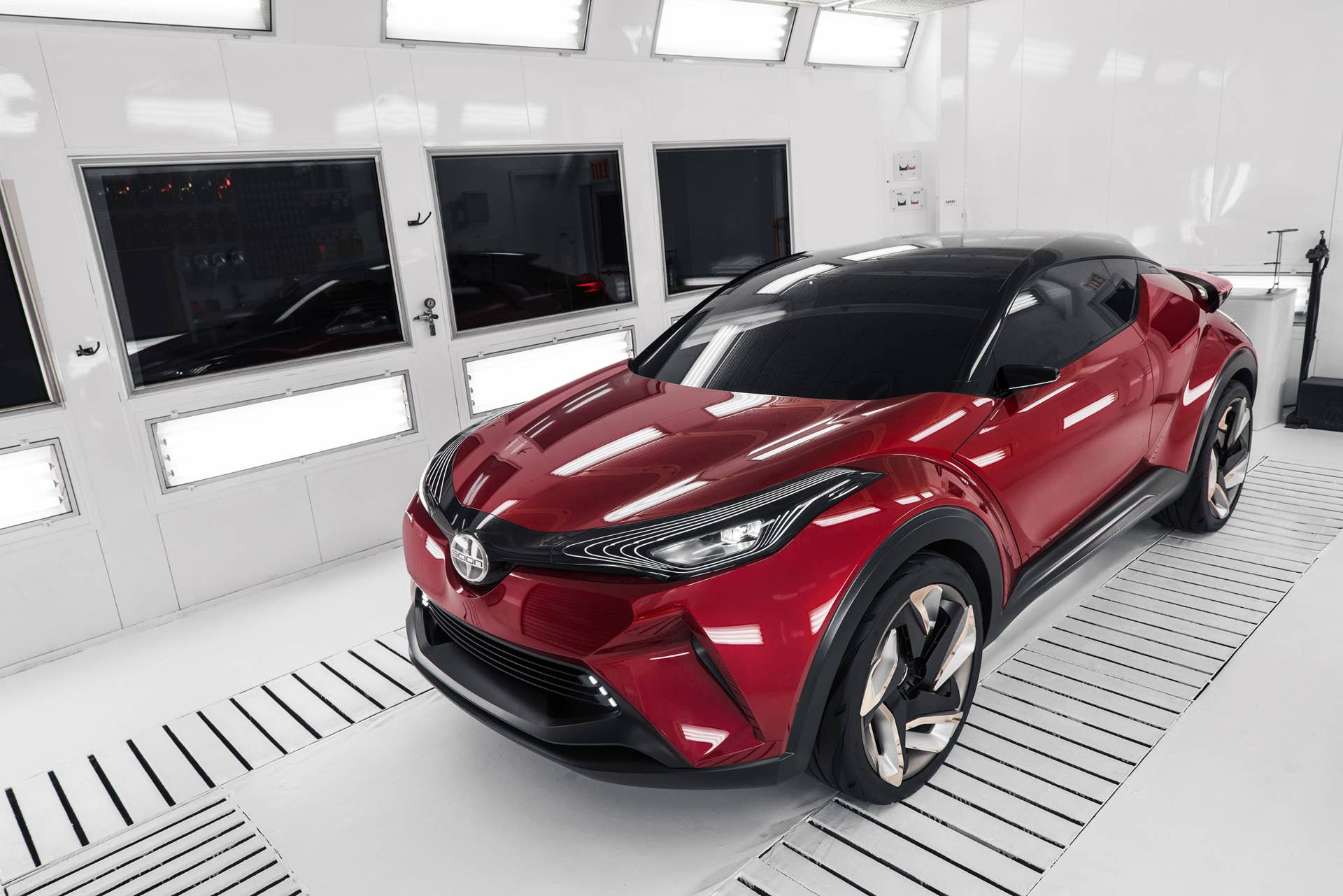 The Scion C-HR concept shown off in red for the LA Auto Show, overhead front three-quarter.