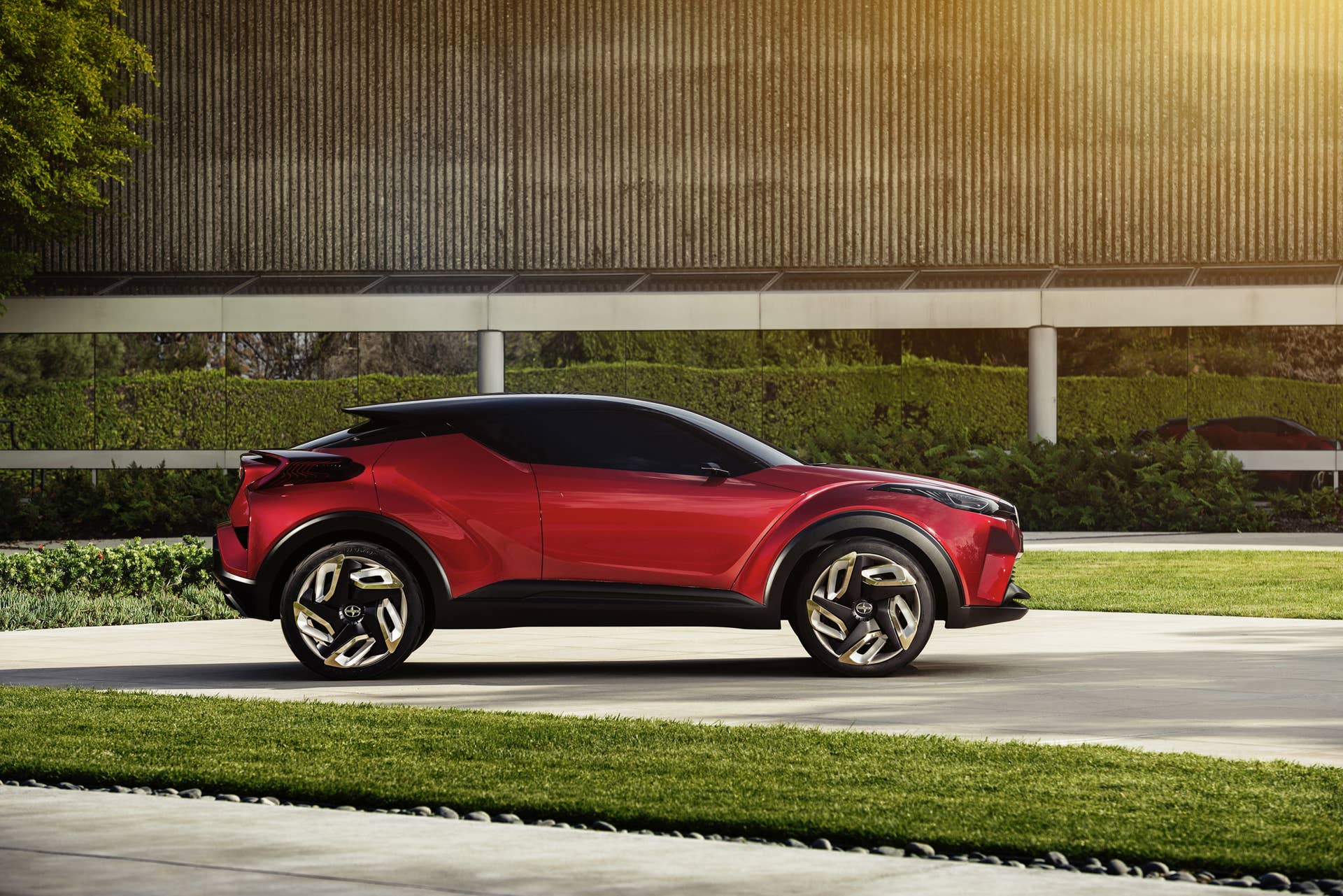 The Scion C-HR concept shown off in red for the LA Auto Show, side view.