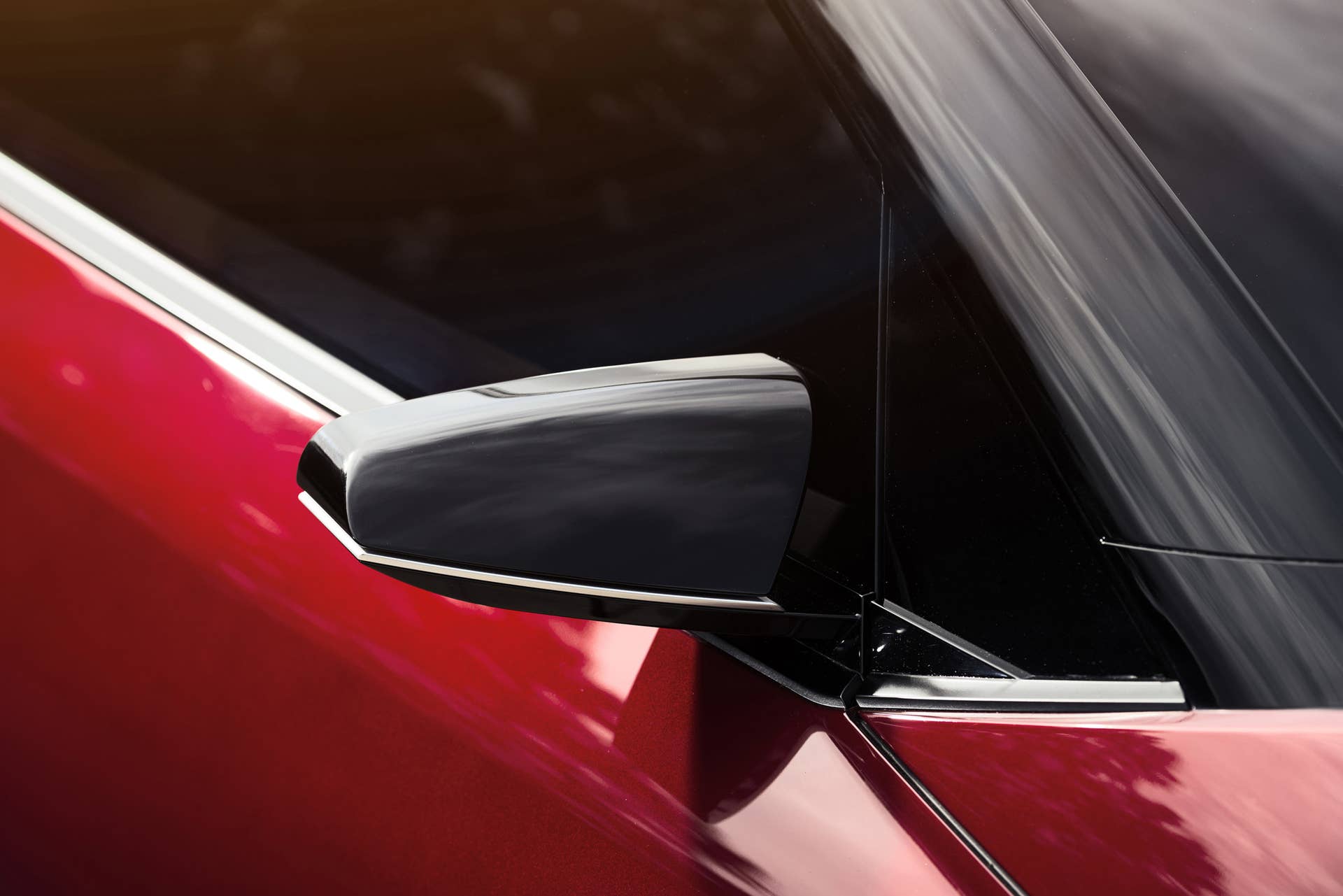 The Scion C-HR concept shown off in red for the LA Auto Show, side mirror detail.