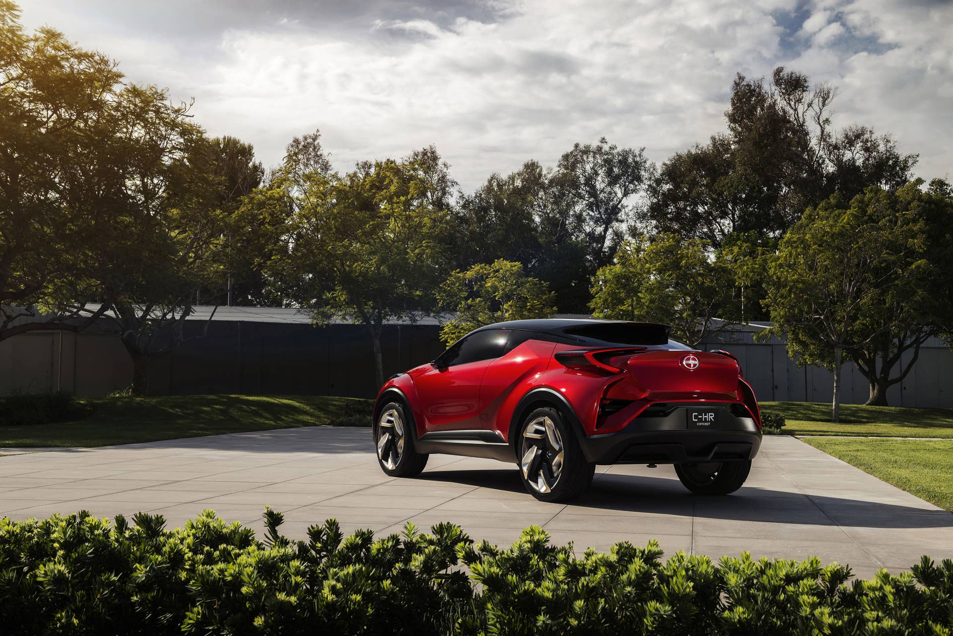 The Scion C-HR concept shown off in red for the LA Auto Show, rear three-quarter.