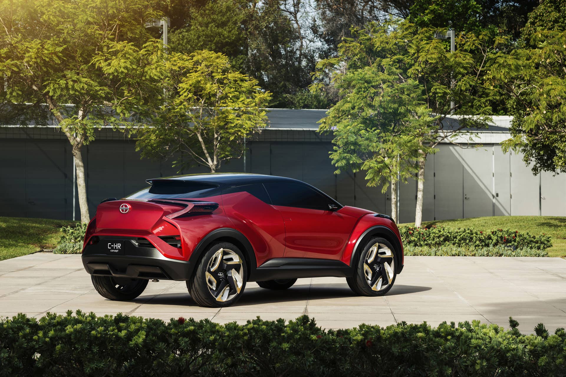 The Scion C-HR concept shown off in red for the LA Auto Show, rear three-quarter.