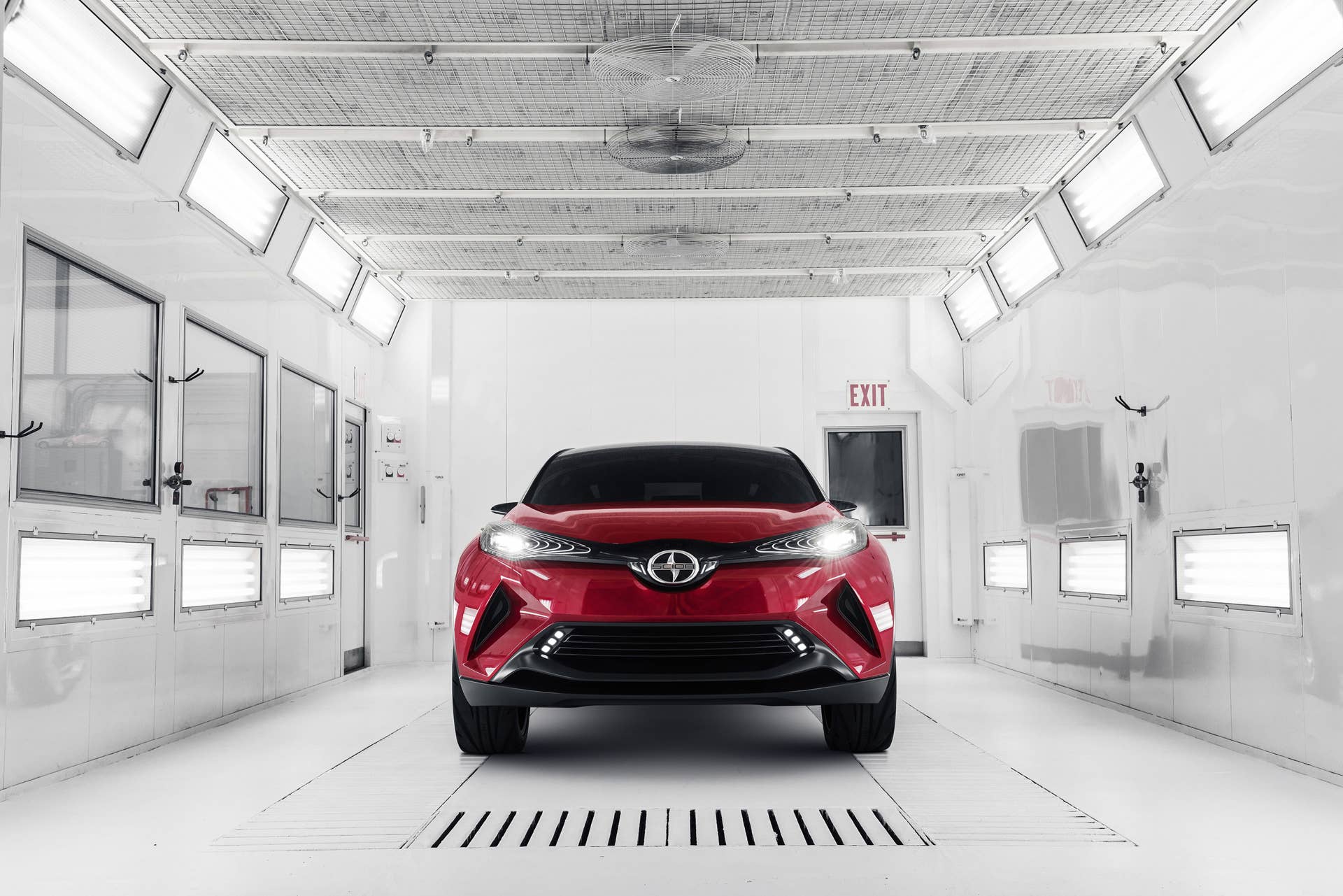 The Scion C-HR concept shown off in red for the LA Auto Show, front view indoors.