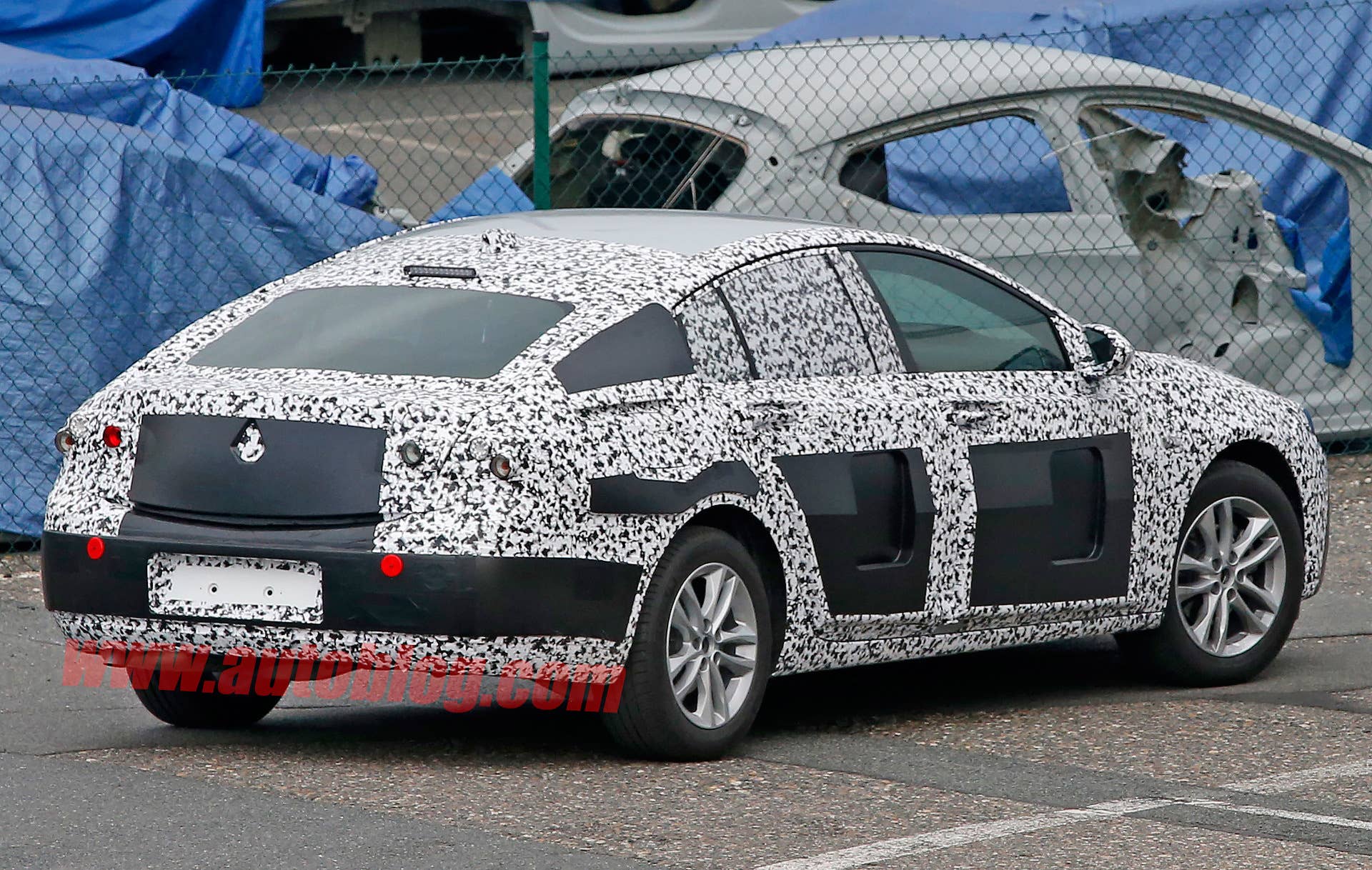 opel hatchback spied roofline camo cladding