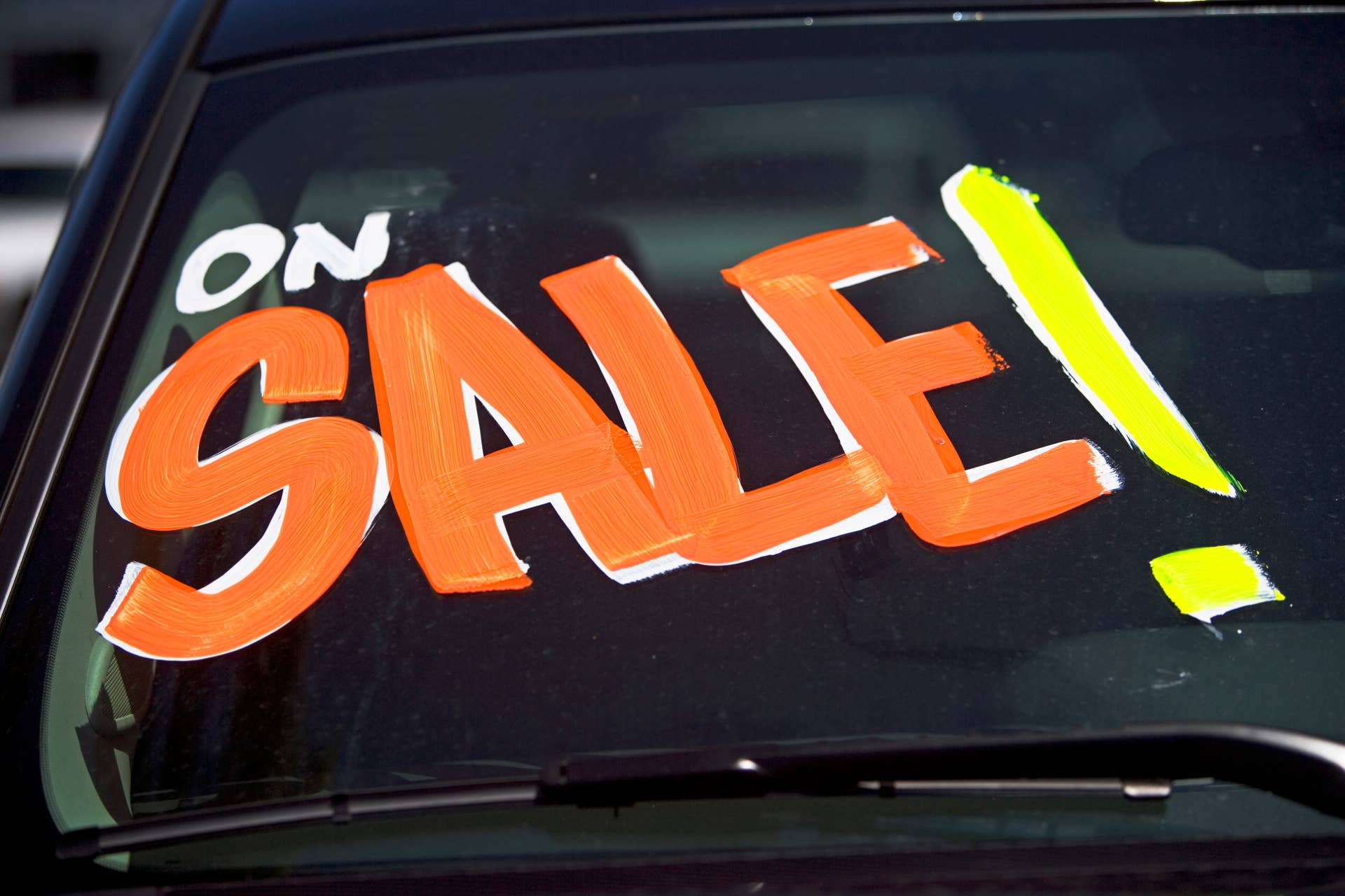 Car with On Sale on windshield