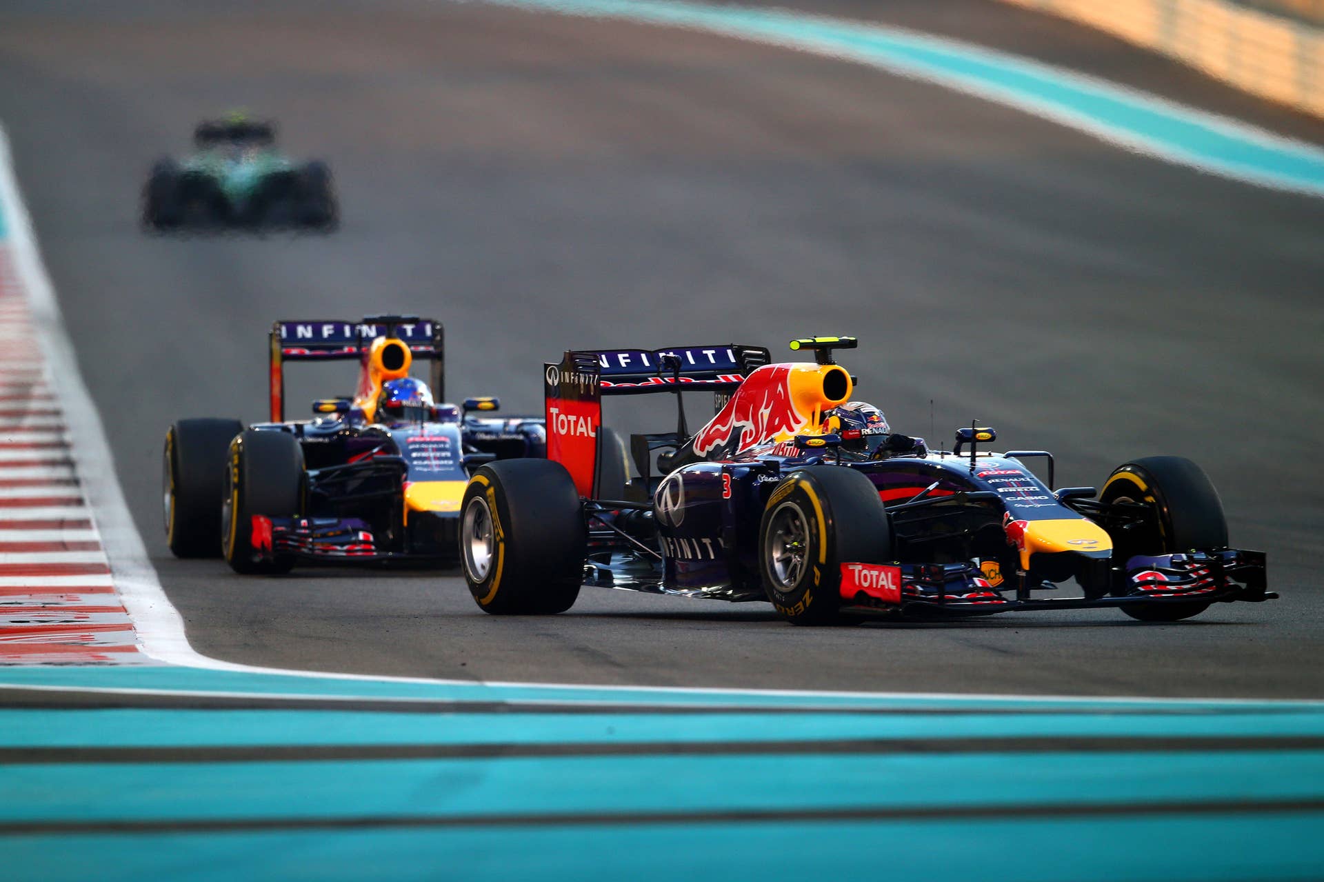 ABU DHABI, UNITED ARAB EMIRATES - NOVEMBER 23:  Daniel Ricciardo of Australia and Infiniti Red Bull Racing leads Sebastian Vettel of Germany and Infiniti Red Bull Racing during the Abu Dhabi Formula One Grand Prix at Yas Marina Circuit on November 23, 2014 in Abu Dhabi, United Arab Emirates.  (Photo by Clive Rose/Getty Images)