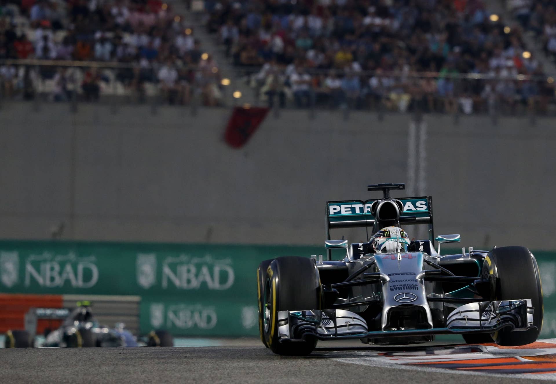 Mercedes-AMG's German driver  Nico Rosberg (L) and Mercedes-AMG's British driver  Lewis Hamilton race during the Abu Dhabi Formula One Grand Prix at the Yas Marina circuit on November 23, 2014.  AFP PHOTO / PATRICK BAZ        (Photo credit should read PATRICK BAZ/AFP/Getty Images)