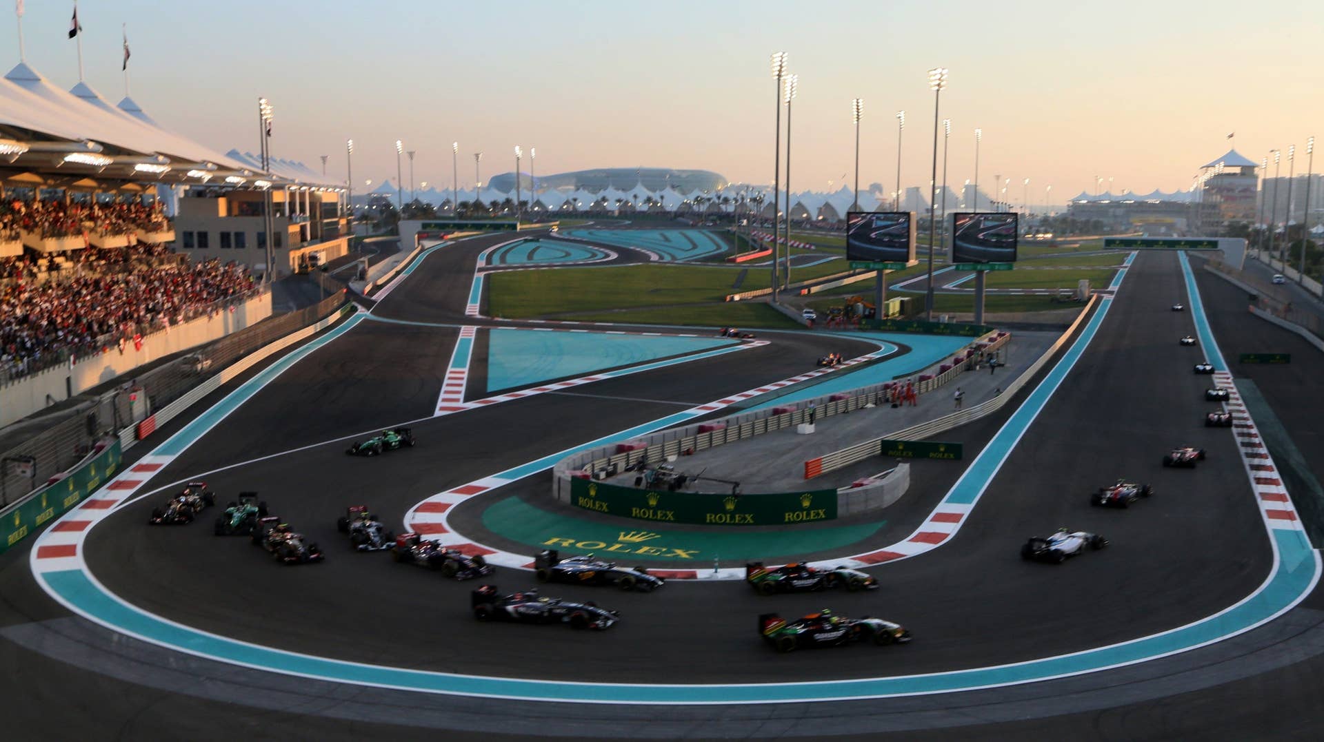 Drivers race during the Abu Dhabi Formula One Grand Prix at the Yas Marina circuit on November 23, 2014.    AFP PHOTO / KARIM SAHIB        (Photo credit should read KARIM SAHIB/AFP/Getty Images)