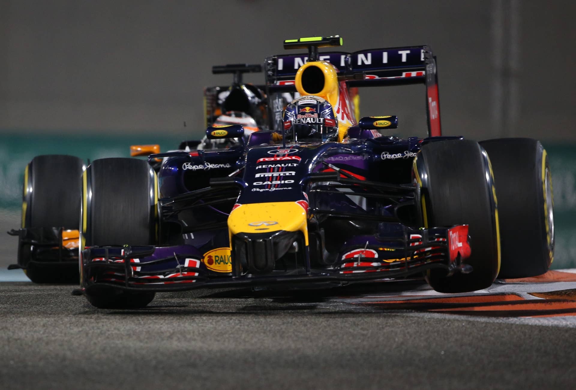 Red Bull Racing's Australian driver Daniel Ricciardo and Force India's German driver  Nico Hulkenberg  races during the Abu Dhabi Formula One Grand Prix at the Yas Marina circuit on November 23, 2014.  AFP PHOTO / PATRICK BAZ        (Photo credit should read PATRICK BAZ/AFP/Getty Images)