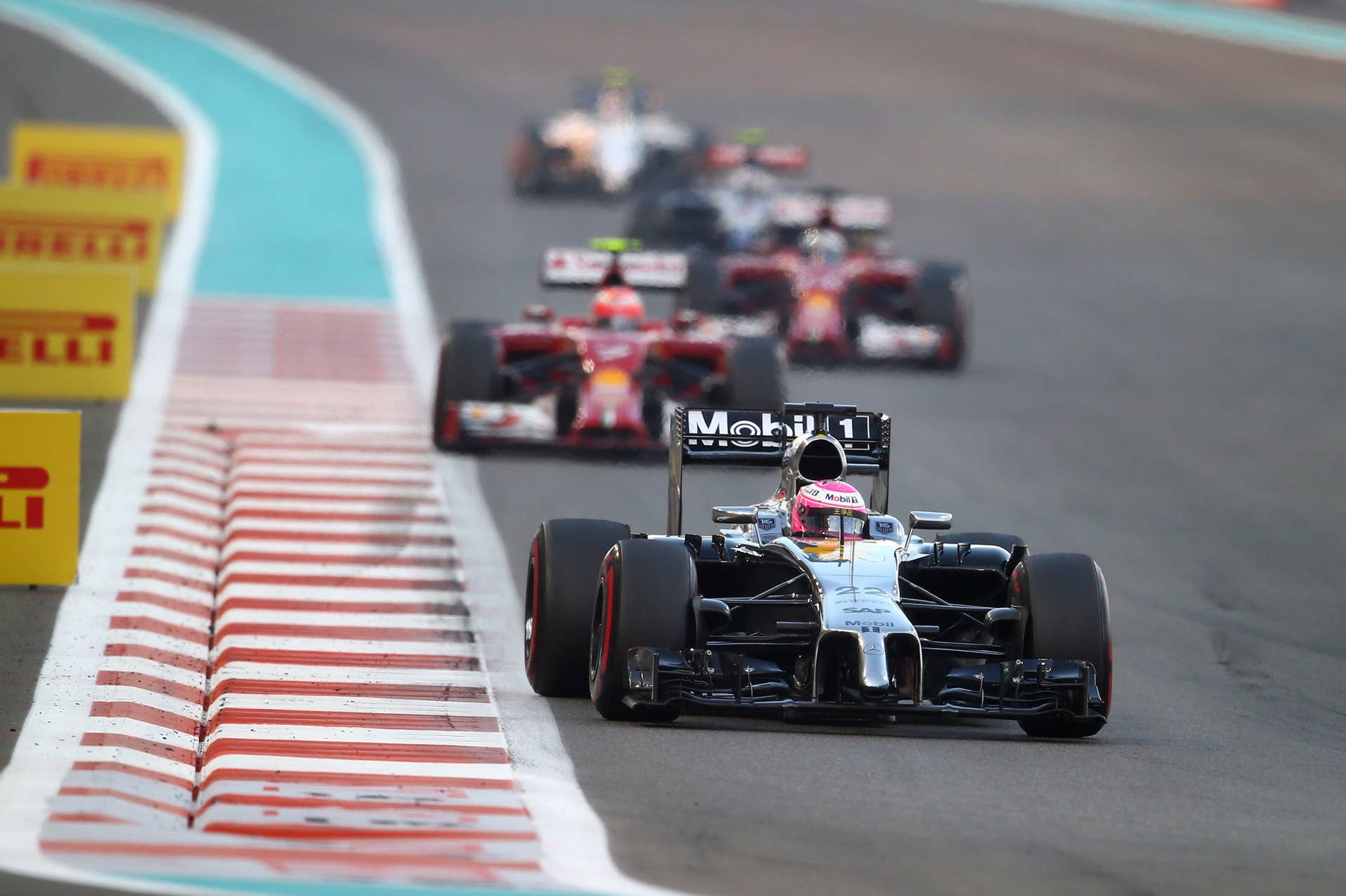 ABU DHABI, UNITED ARAB EMIRATES - NOVEMBER 23:  Jenson Button of Great Britain and McLaren drives during the Abu Dhabi Formula One Grand Prix at Yas Marina Circuit on November 23, 2014 in Abu Dhabi, United Arab Emirates.  (Photo by Clive Rose/Getty Images)