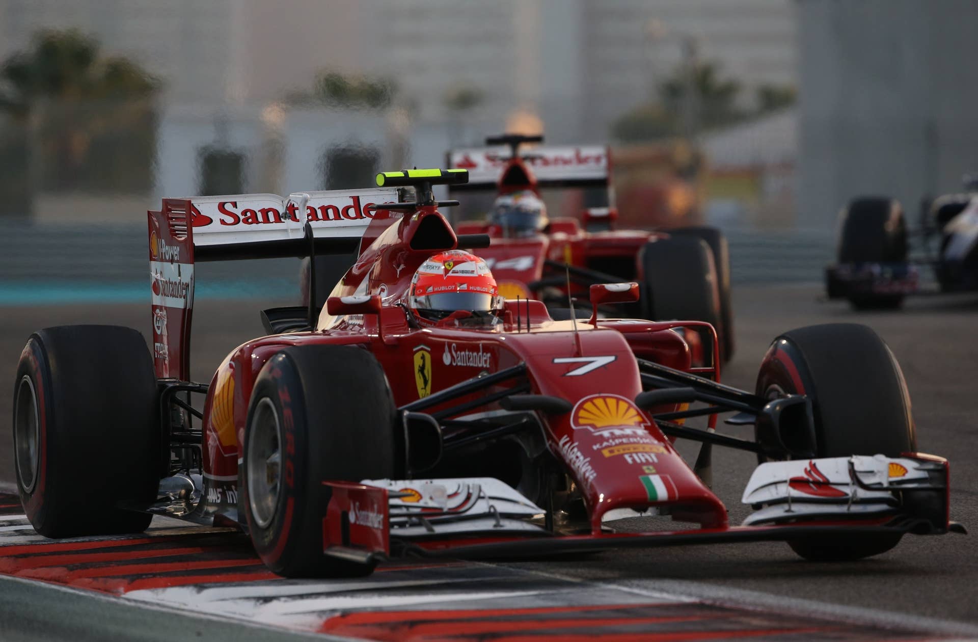 Ferrari's Spanish driver  Fernando Alonso and Ferrari's Finnish driver  Kimi Raikkonen  race during the Abu Dhabi Formula One Grand Prix at the Yas Marina circuit on November 23, 2014.  AFP PHOTO / PATRICK BAZ        (Photo credit should read PATRICK BAZ/AFP/Getty Images)