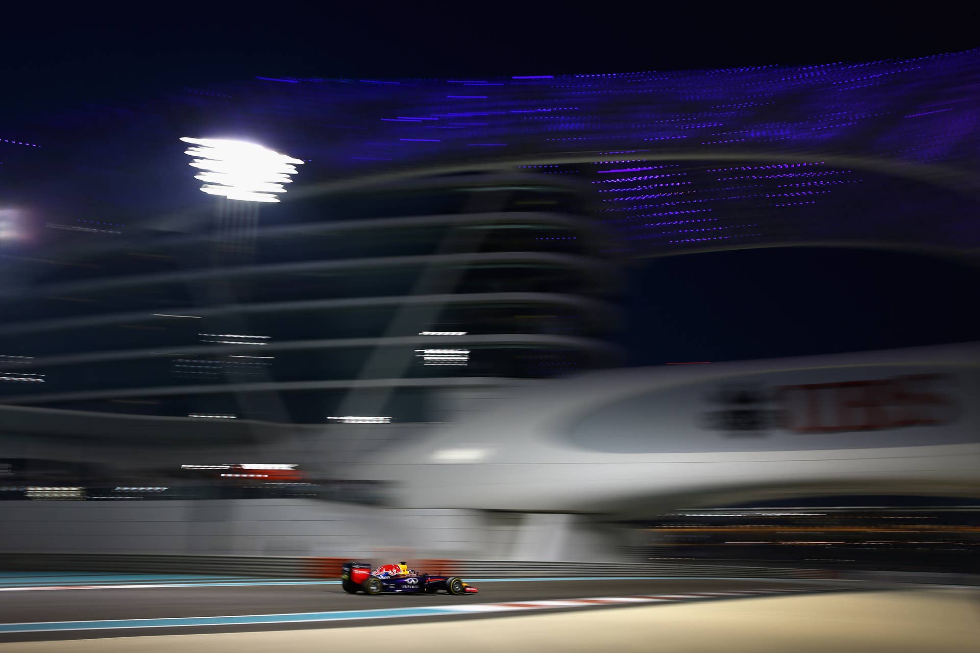 ABU DHABI, UNITED ARAB EMIRATES - NOVEMBER 23:  Sebastian Vettel of Germany and Infiniti Red Bull Racing drives during the Abu Dhabi Formula One Grand Prix at Yas Marina Circuit on November 23, 2014 in Abu Dhabi, United Arab Emirates.  (Photo by Clive Mason/Getty Images)