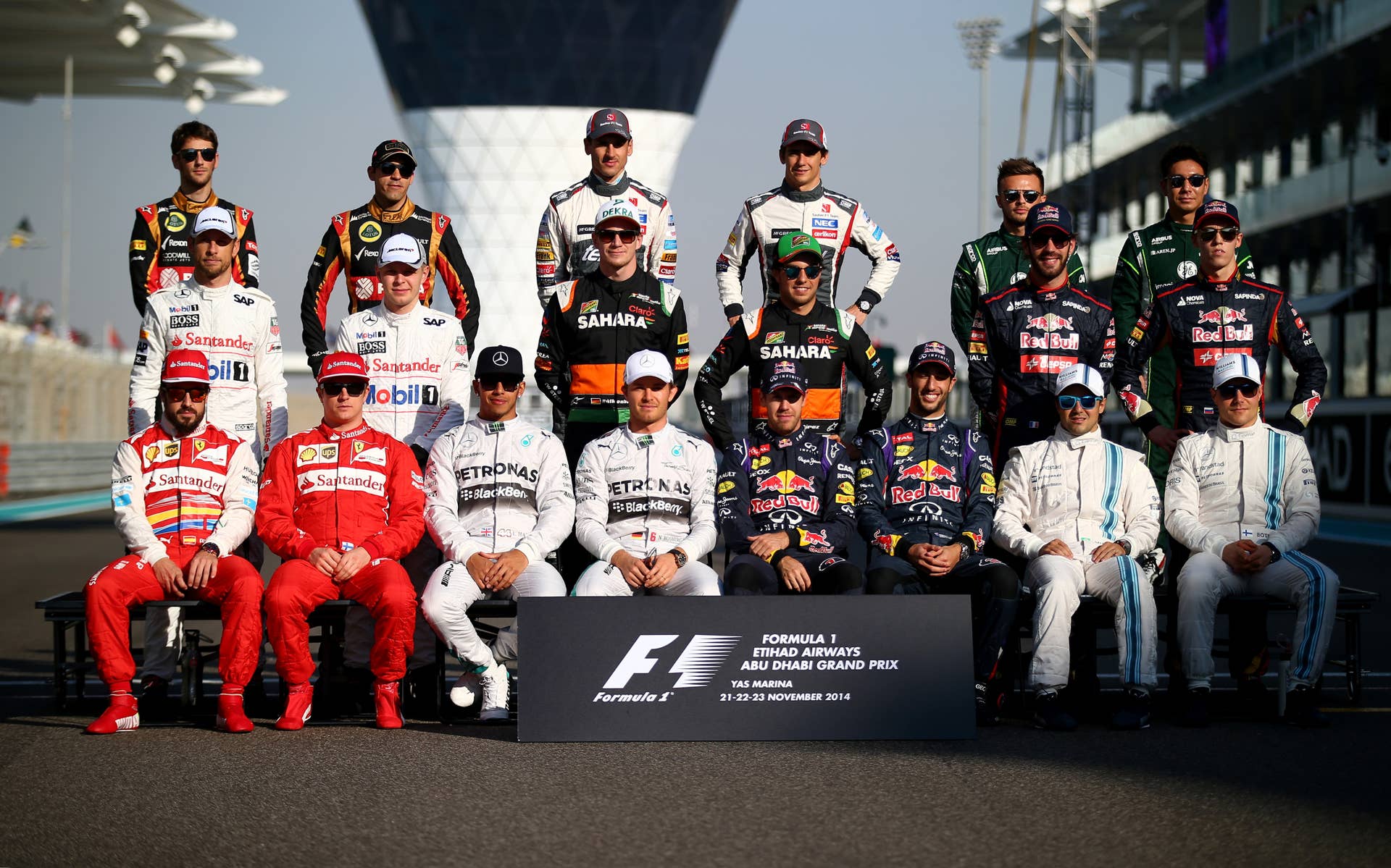 ABU DHABI, UNITED ARAB EMIRATES - NOVEMBER 23: (L-R front row) Fernando Alonso of Spain and Ferrari, Kimi Raikkonen of Finland and Ferrari, Lewis Hamilton of Great Britain and Mercedes GP, Nico Rosberg of Germany and Mercedes GP, Sebastian Vettel of Germany and Infiniti Red Bull Racing, Daniel Ricciardo of Australia and Infiniti Red Bull Racing, Felipe Massa of Brazil and Williams and Valtteri Bottas of Finland and Williams, (L-R middle row) Jenson Button of Great Britain and McLaren, Kevin Magnussen of Denmark and McLaren, Nico Hulkenberg of Germany and Force India, Sergio Perez of Mexico and Force India, Jean-Eric Vergne of France and Scuderia Toro Rosso and Daniil Kvyat of Russia and Scuderia Toro Rosso, (L-R back row) Romain Grosjean of France and Lotus, Pastor Maldonado of Venezuela and Lotus, Adrian Sutil of Germany and Sauber F1, Esteban Gutierrez of Mexico and Sauber F1, Will Stevens of Great Britain and Caterham and Kamui Kobayashi of Japan and Caterham pose for a drivers' photo before the Abu Dhabi Formula One Grand Prix at Yas Marina Circuit on November 23, 2014 in Abu Dhabi, United Arab Emirates.
