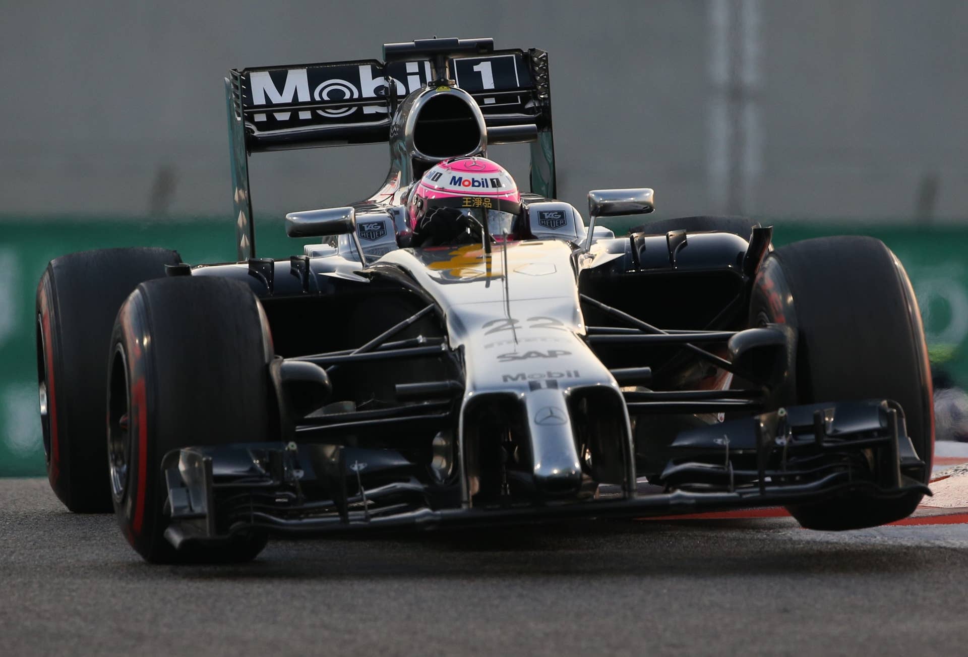 McLaren Mercedes'  British driver  Jenson Button races during the Abu Dhabi Formula One Grand Prix at the Yas Marina circuit on November 23, 2014.  AFP PHOTO / PATRICK BAZ        (Photo credit should read PATRICK BAZ/AFP/Getty Images)