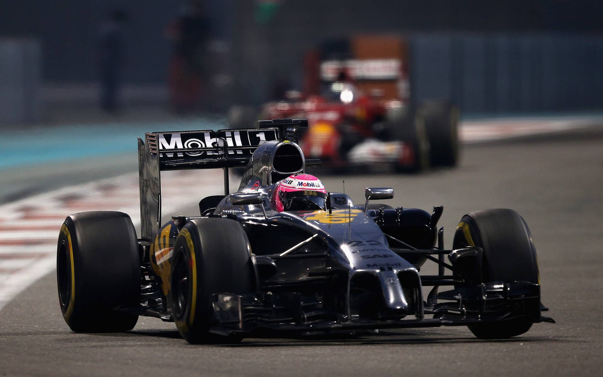 ABU DHABI, UNITED ARAB EMIRATES - NOVEMBER 23:  Jenson Button of Great Britain and McLaren drives during the Abu Dhabi Formula One Grand Prix at Yas Marina Circuit on November 23, 2014 in Abu Dhabi, United Arab Emirates.  (Photo by Clive Mason/Getty Images)