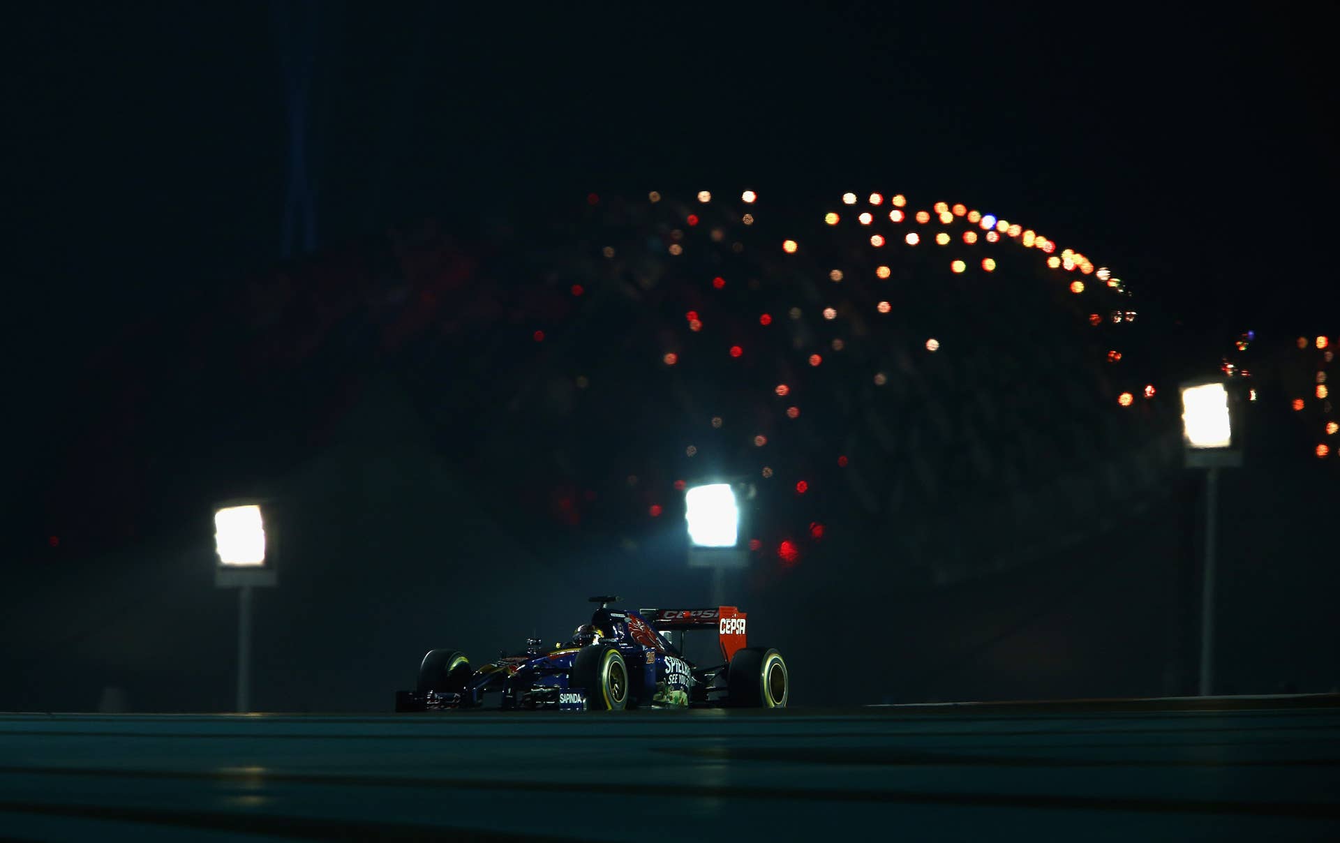 ABU DHABI, UNITED ARAB EMIRATES - NOVEMBER 23:  Jean-Eric Vergne of France and Scuderia Toro Rosso drives during the Abu Dhabi Formula One Grand Prix at Yas Marina Circuit on November 23, 2014 in Abu Dhabi, United Arab Emirates.  (Photo by Mark Thompson/Getty Images)