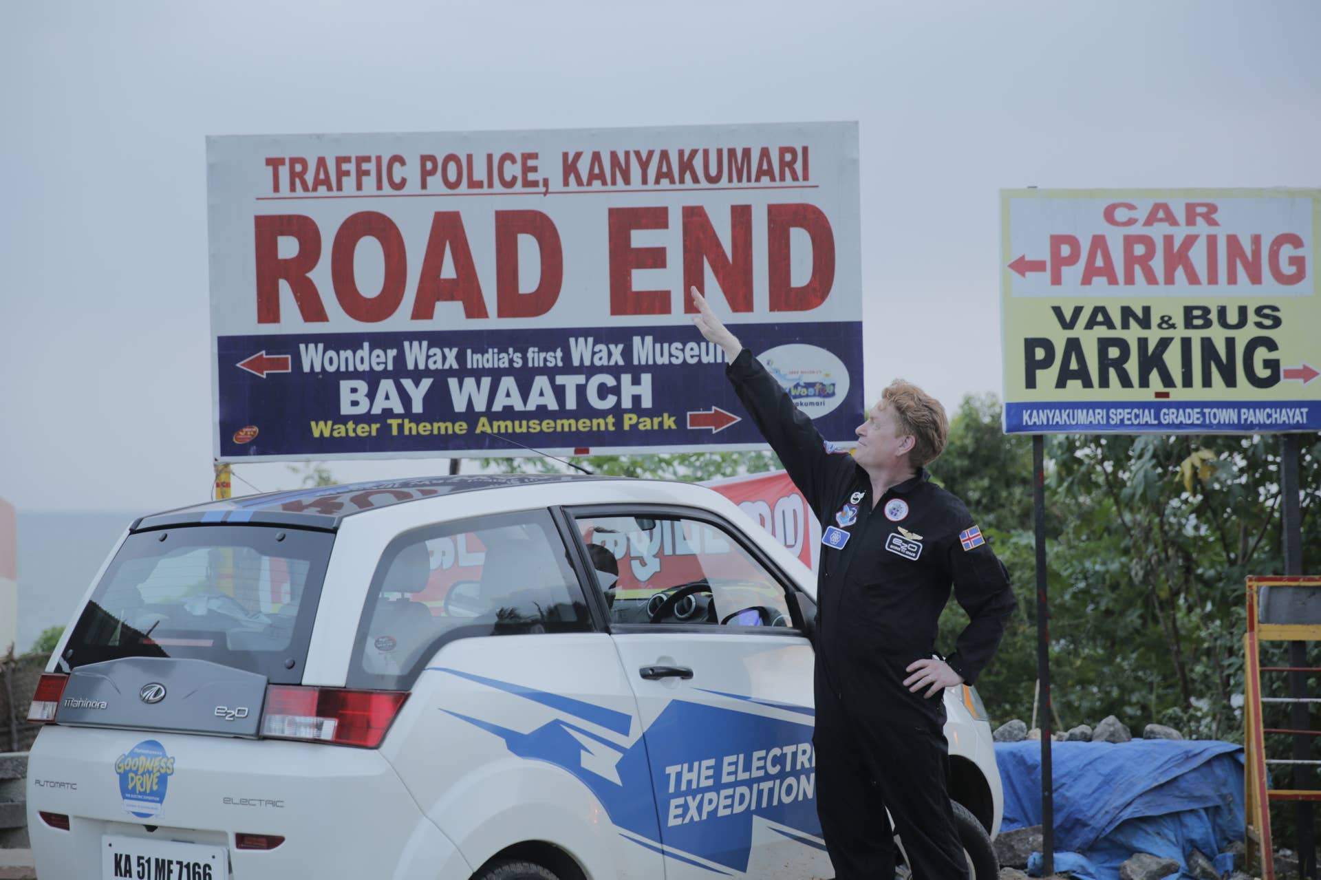 Gisli Gislason points to the Road End sign in Kanyakumari, India during the Mahindra Electric Expedition.